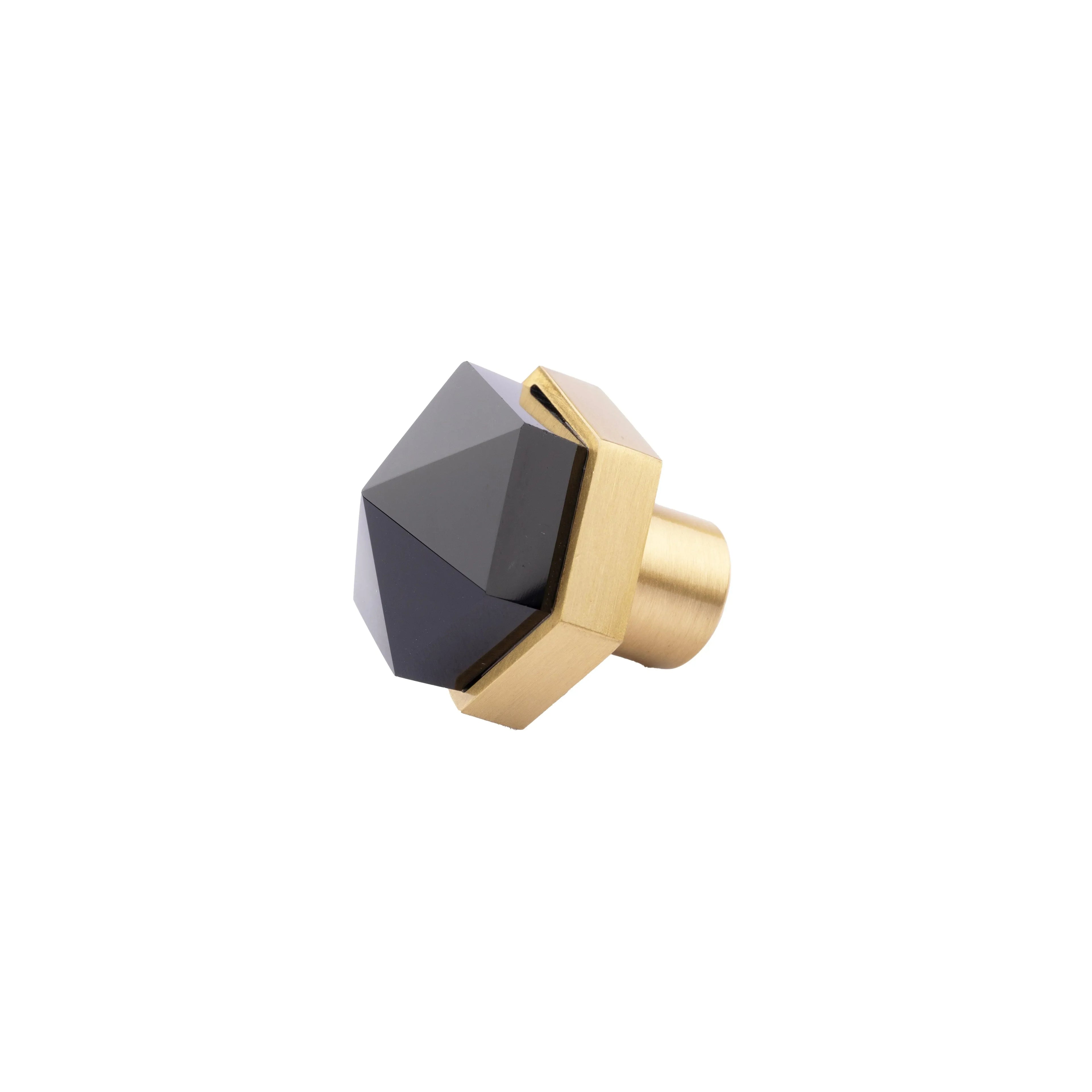 The Mantara C-0005 is a modern crystal + brass knob in black, ideal for cabinets and wardrobes.
