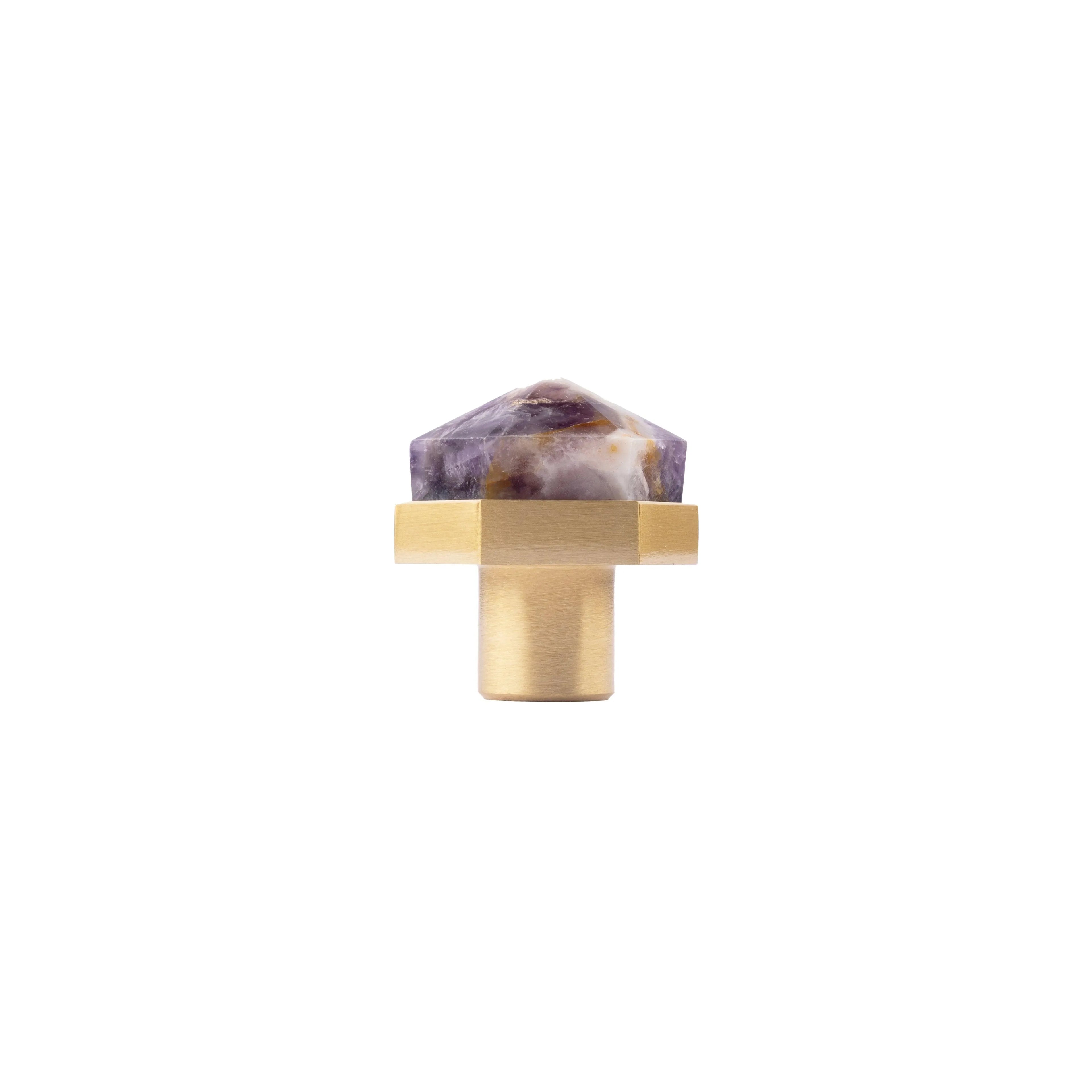 The Mantara C-0005 is a modern crystal + brass knob in purple, ideal for cabinets and wardrobes.