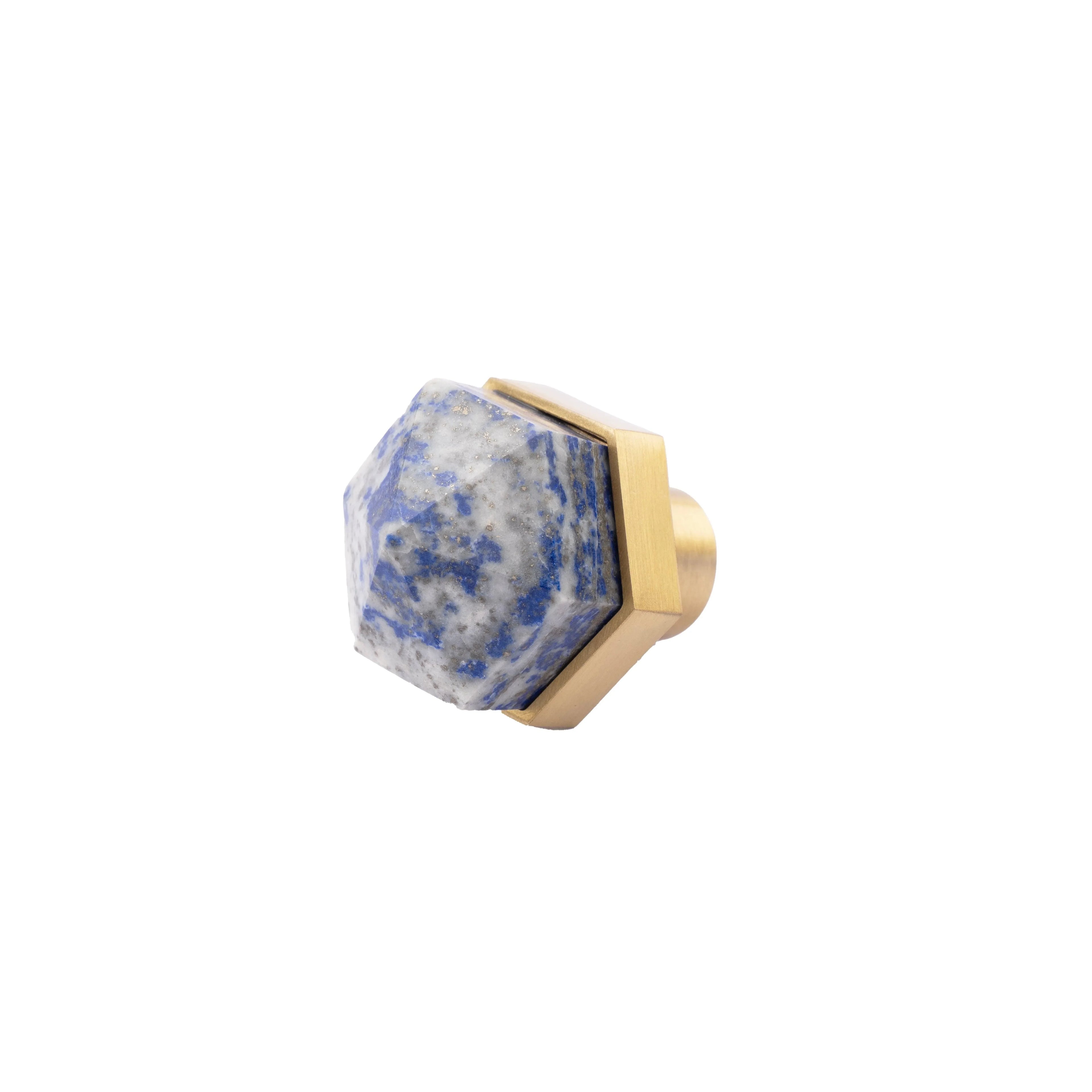 The Mantara C-0005 is a modern crystal + brass knob in blue, ideal for cabinets and wardrobes.