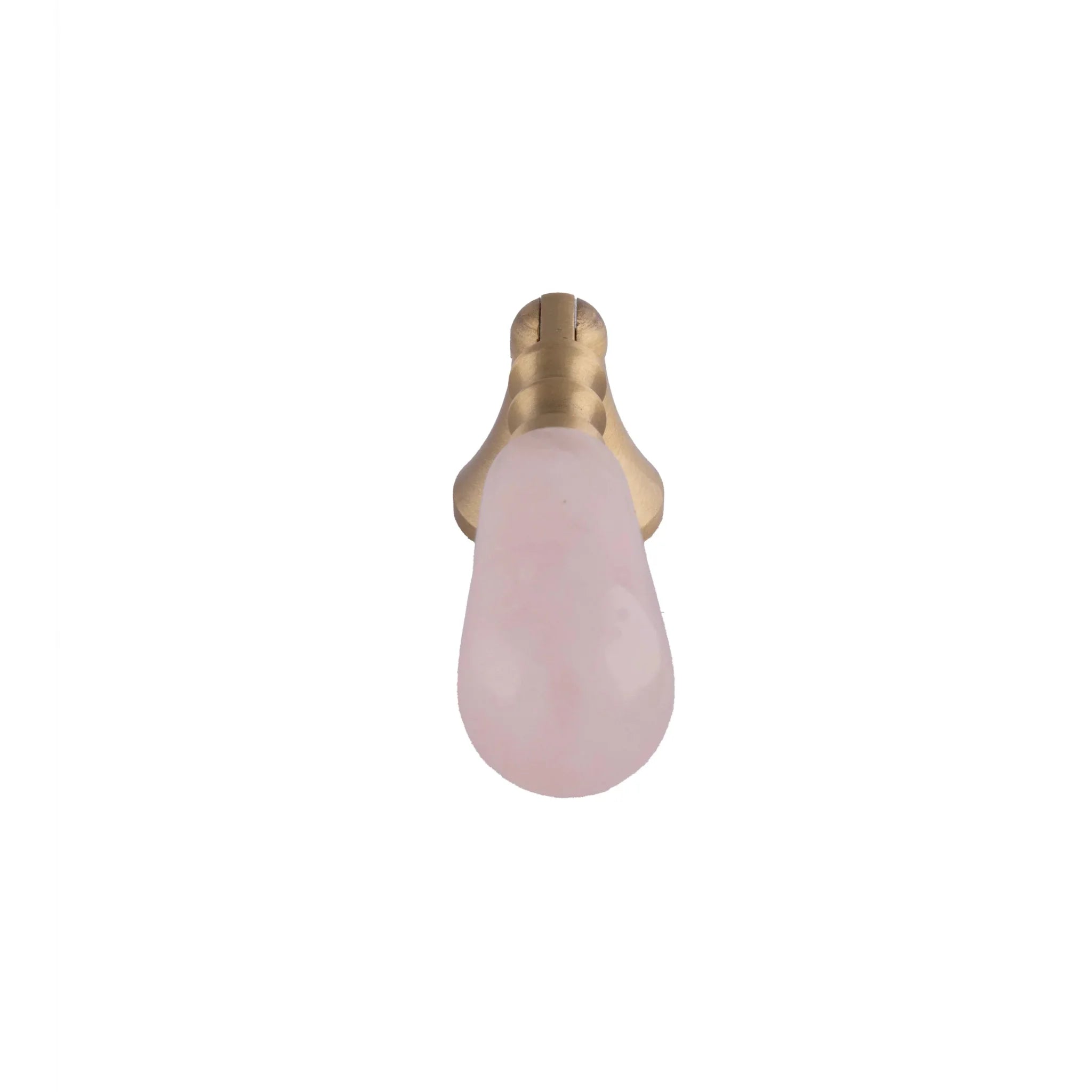 The Mantara C-0007 is a modern natural crystal + brass drop knob in pink, ideal for wardrobes and drawers.