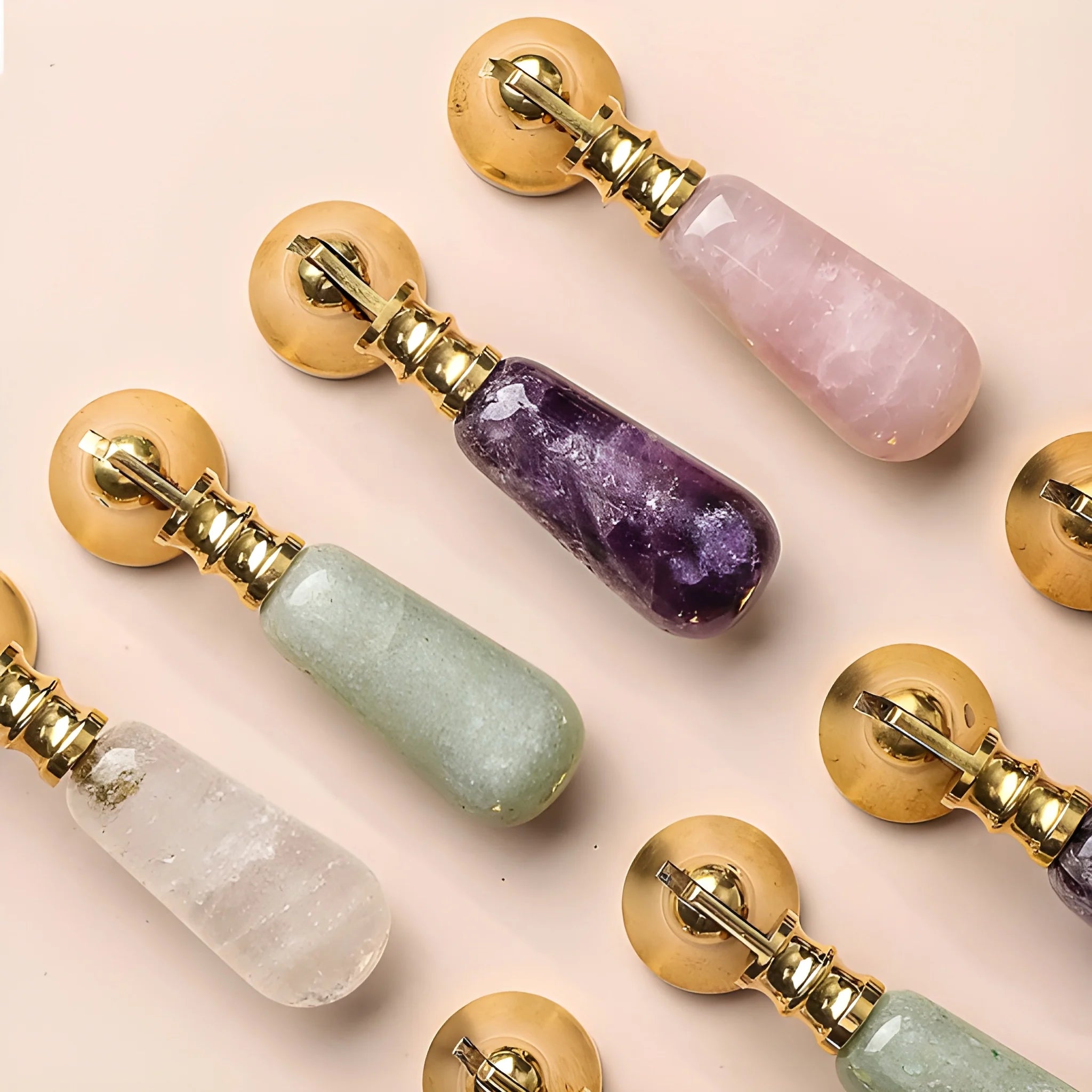 The Mantara C-0007 is a modern natural crystal + brass drop knob in purple, ideal for wardrobes and drawers.