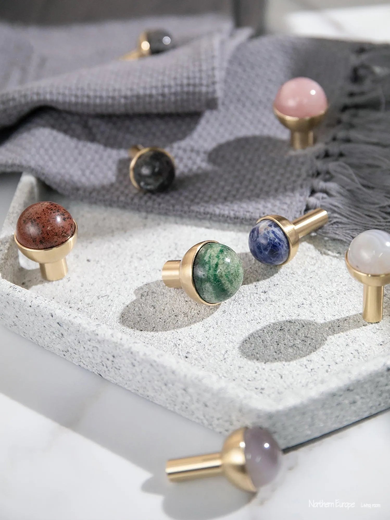 The Mantara C-0006 is a modern crystal + brass knob in blue, ideal for drawers and cabinets.