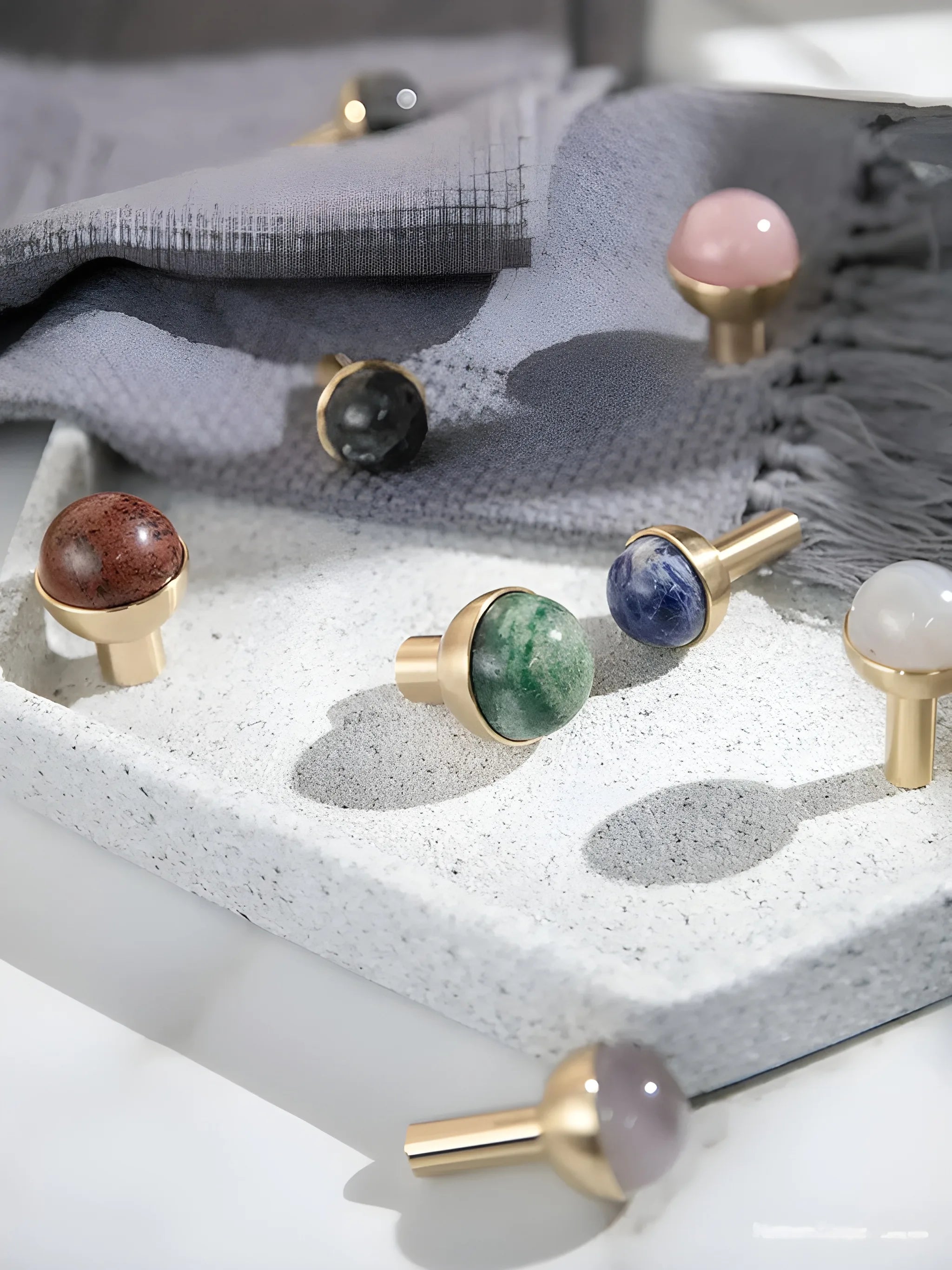 The Mantara C-0006 is a modern crystal + brass knob in blue, ideal for drawers and cabinets.