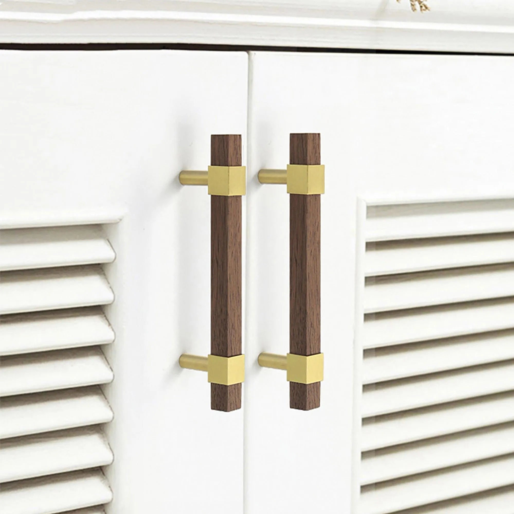 Ebonex Handle W-0009 in brushed brass & walnut, sizes 70–391mm, suits doors, cabinets & wardrobes—by Mantara.