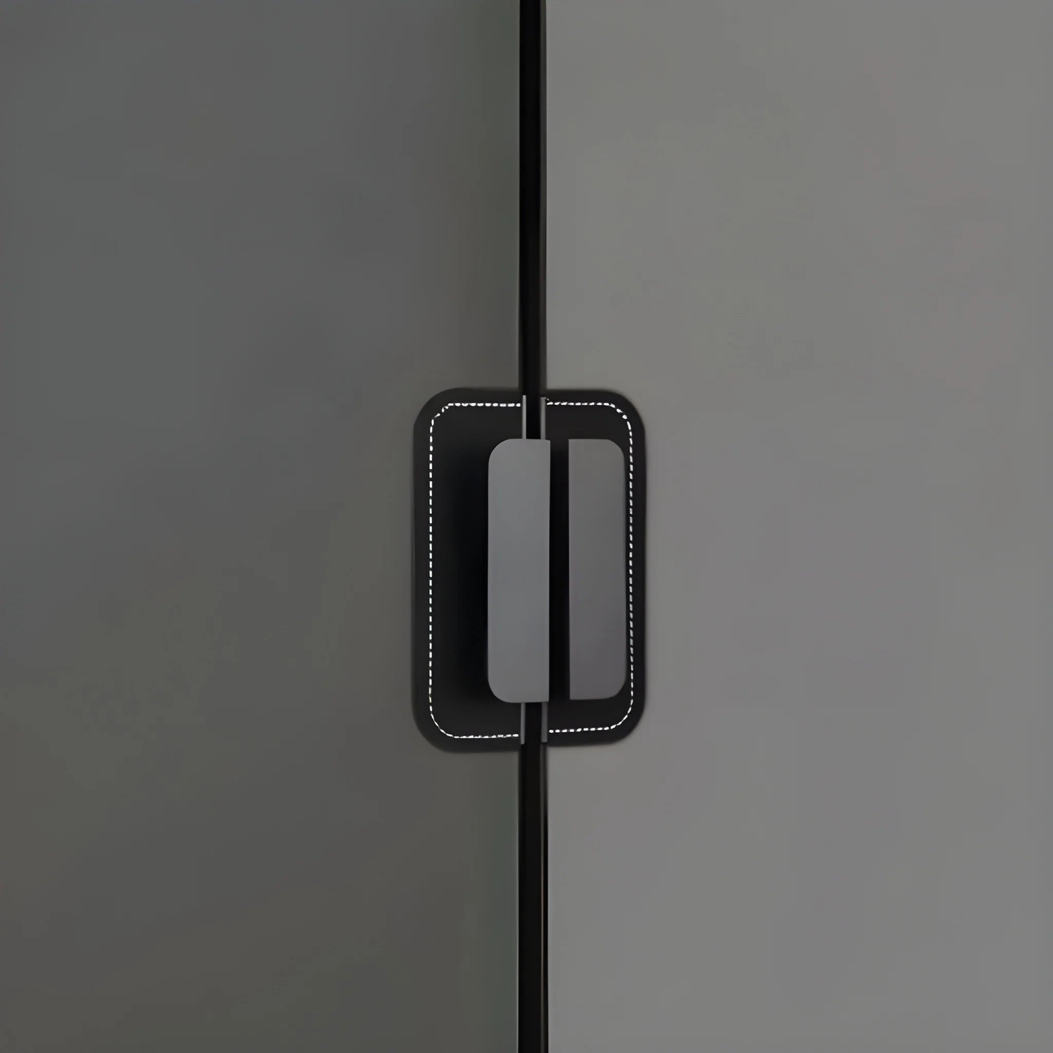 The Mantara L-0007 Geometry Leather Handle is a modern grey and black handle in matte finish, ideal for doors, cabinets, and wardrobes.