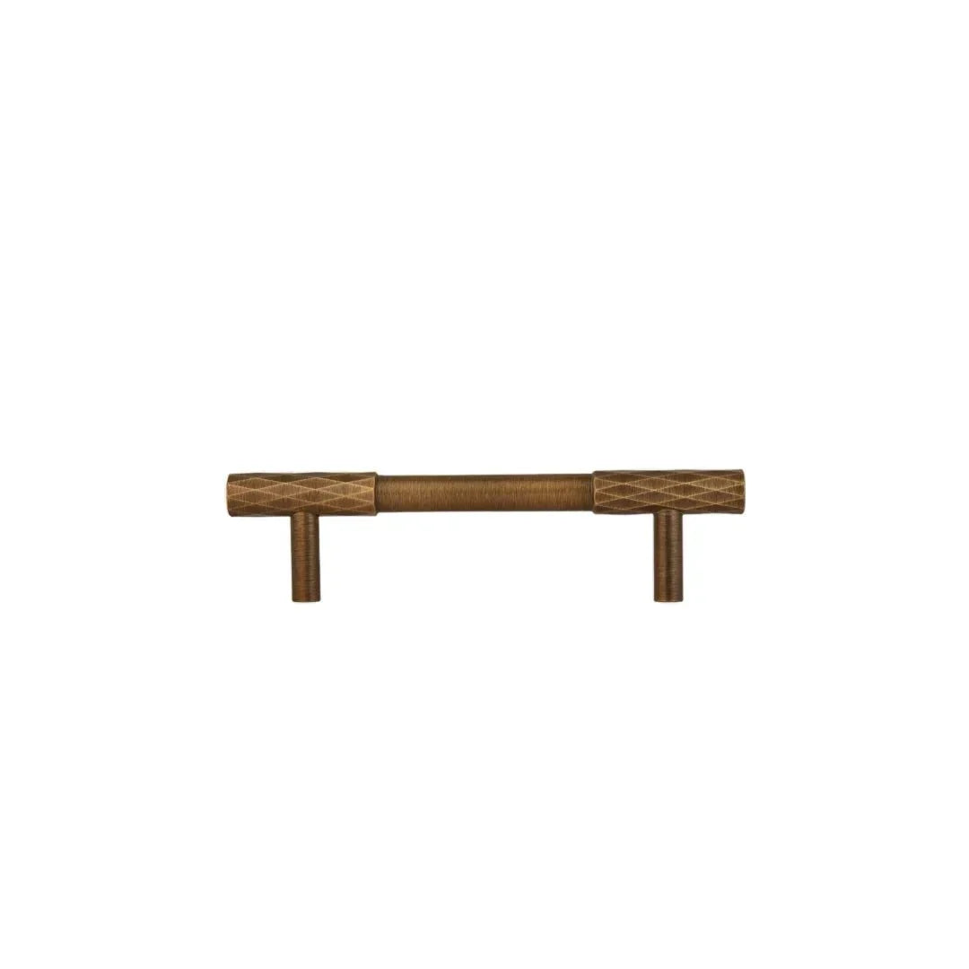 The Mantara B-0130 Ferra Handle is a modern brass handle in bronze finish, perfect for kitchen drawers, cabinets, and furniture.