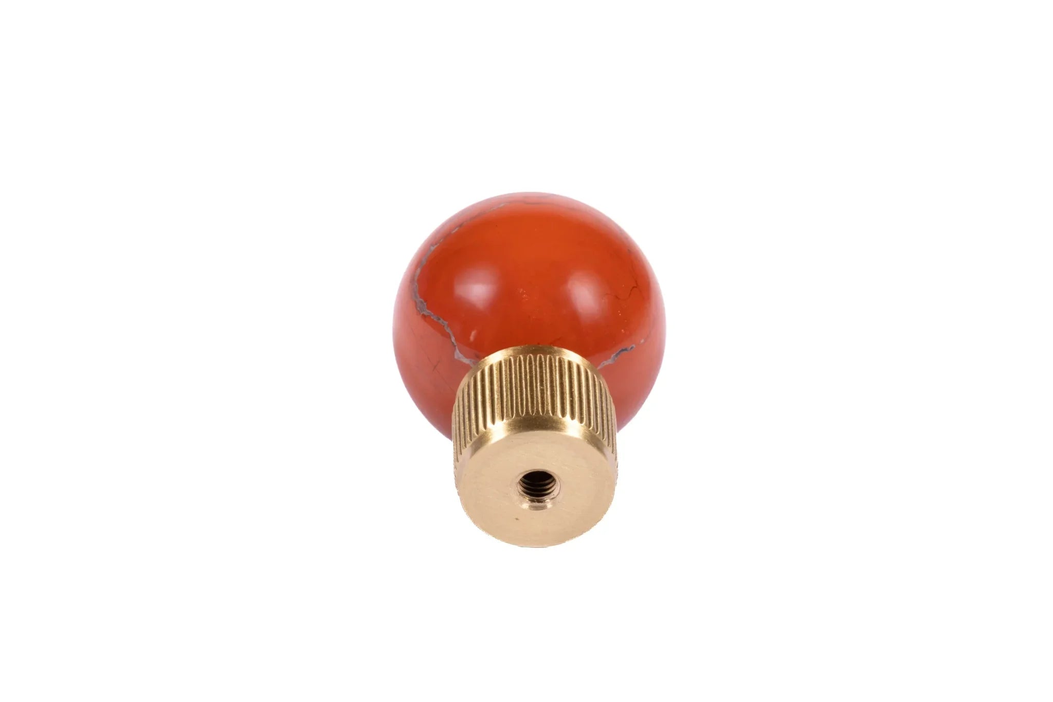 The Mantara C-0028 Geodelle Knob is a modern crystal knob in red, perfect for drawers, cabinets, and wardrobes.