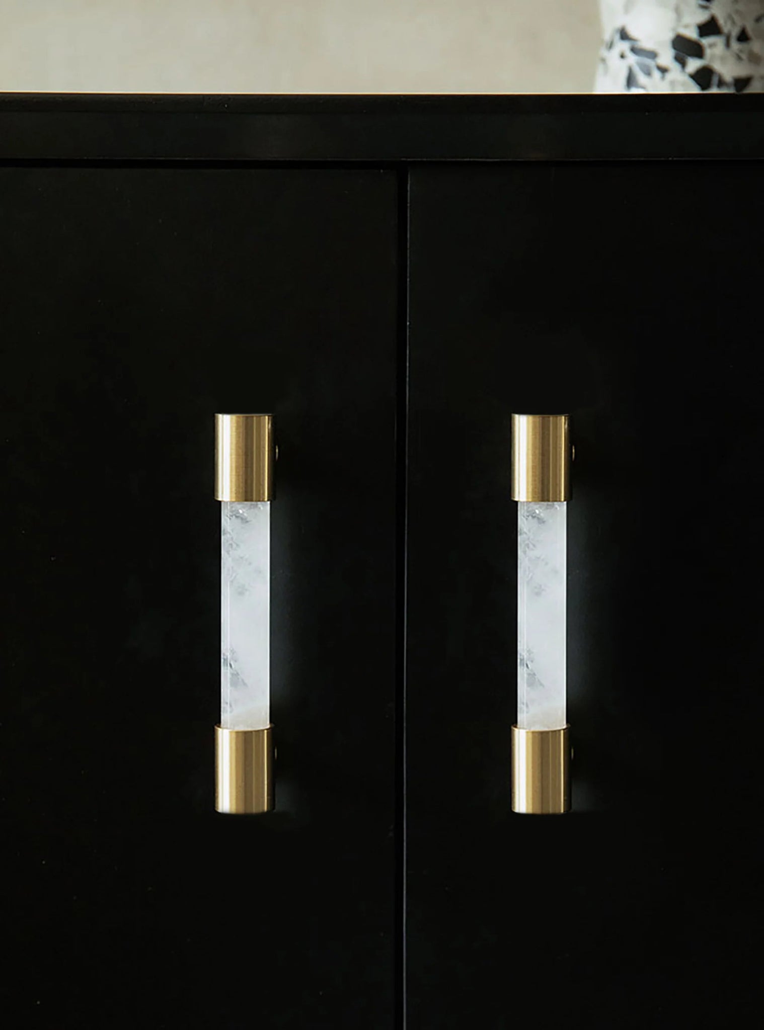 The Mantara C-0014-96 Haze Handle is a modern crystal and brass handle in white, ideal for cabinets and wardrobes.