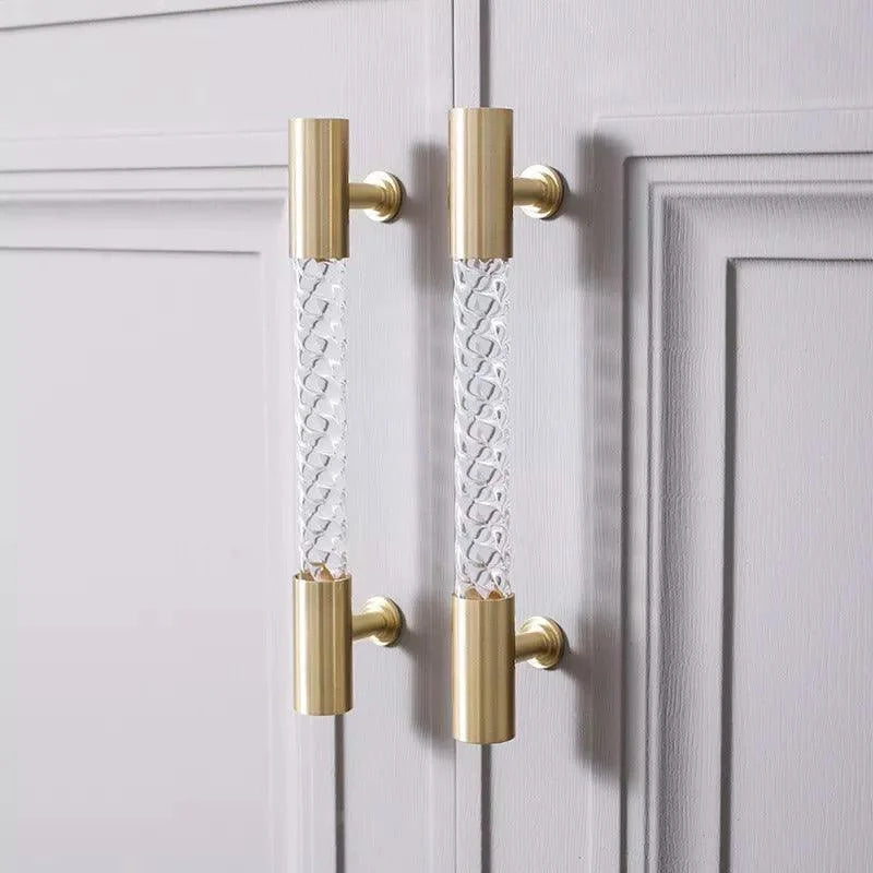 The Mantara A-0012 Helix Handle is a modern white brass and acrylic handle with polished + brushed stem, ideal for doors, cabinets, and wardrobes.