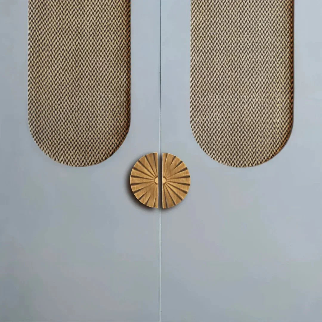 The Mantara B-0029 Kanti Knob is a modern brass knob in brushed gold and bronze, ideal for doors, kitchens, and cabinets.