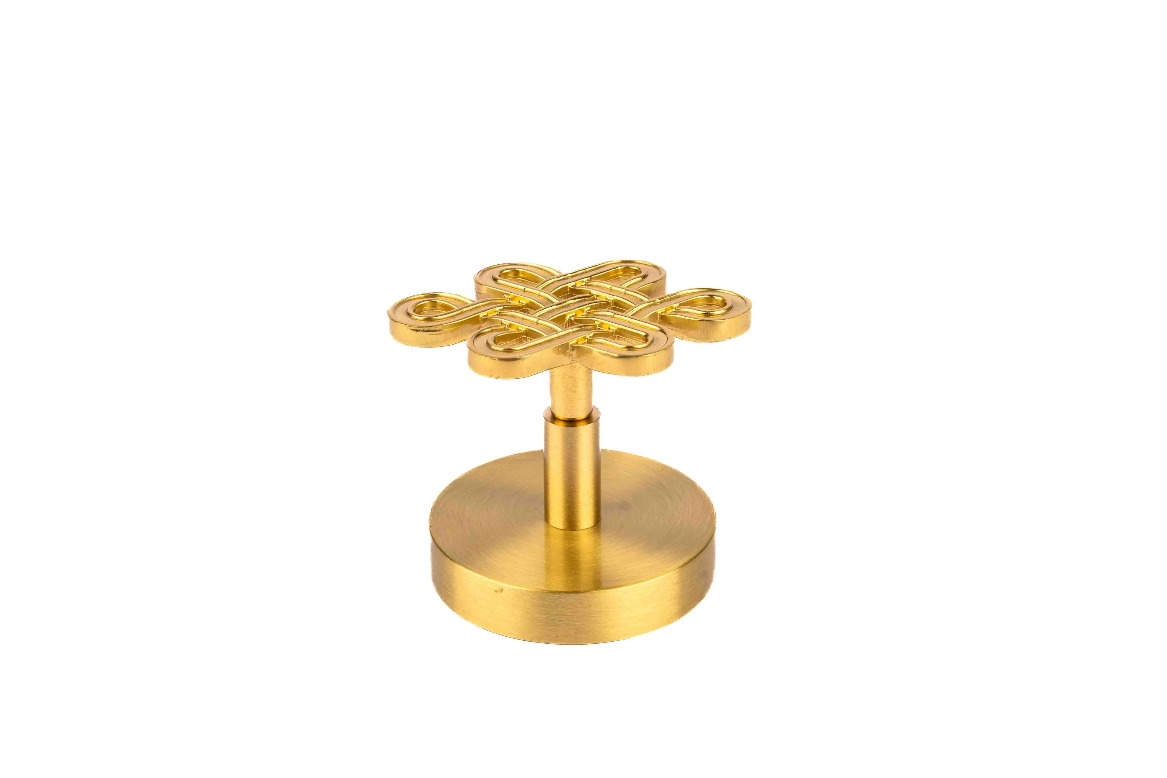 The Lattice Hook by Mantara B-0116 is a modern brass wall hook in gold with a brushed finish, ideal for kitchens and bedrooms.