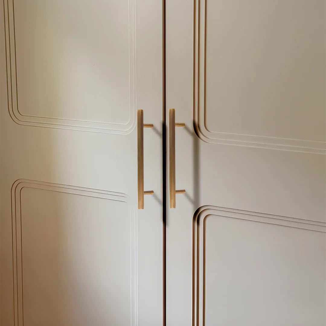 The Mantara B-0052 Oblivion T-Bar Handle is a modern solid brass handle in bronze, ideal for cabinets and kitchens.