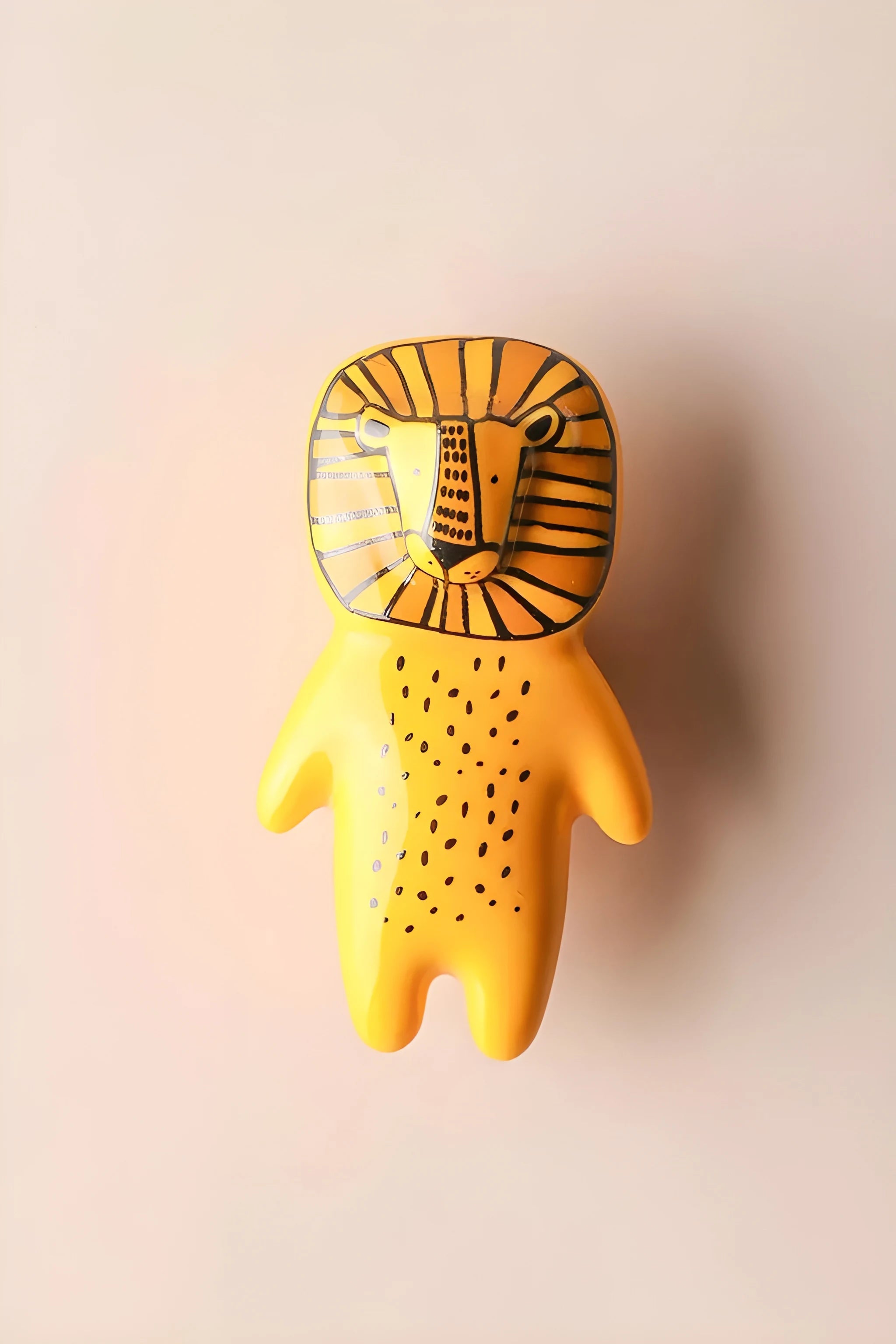 The Mantara CR-0001-Lion Knob is a modern yellow ceramic knob with a polished finish, ideal for wardrobes, cabinets, and kids&