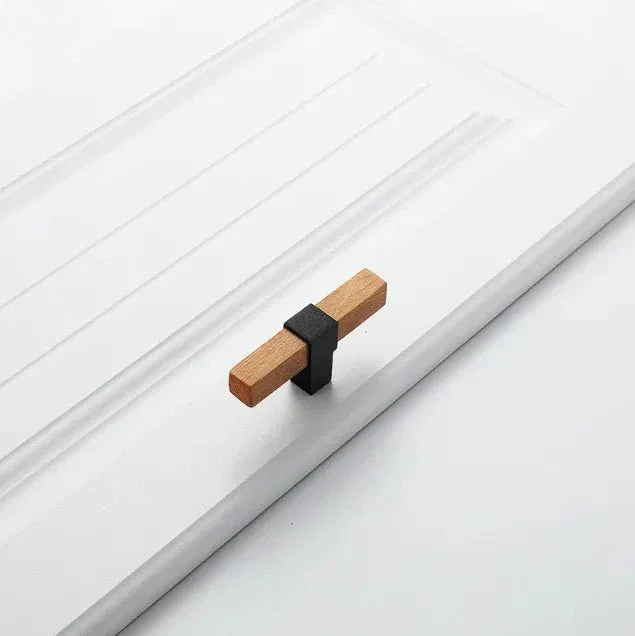 Mantara Lorien Handle W-0028 is a modern zinc and beech wood Tbar in black ideal for kitchen and dresser drawers.