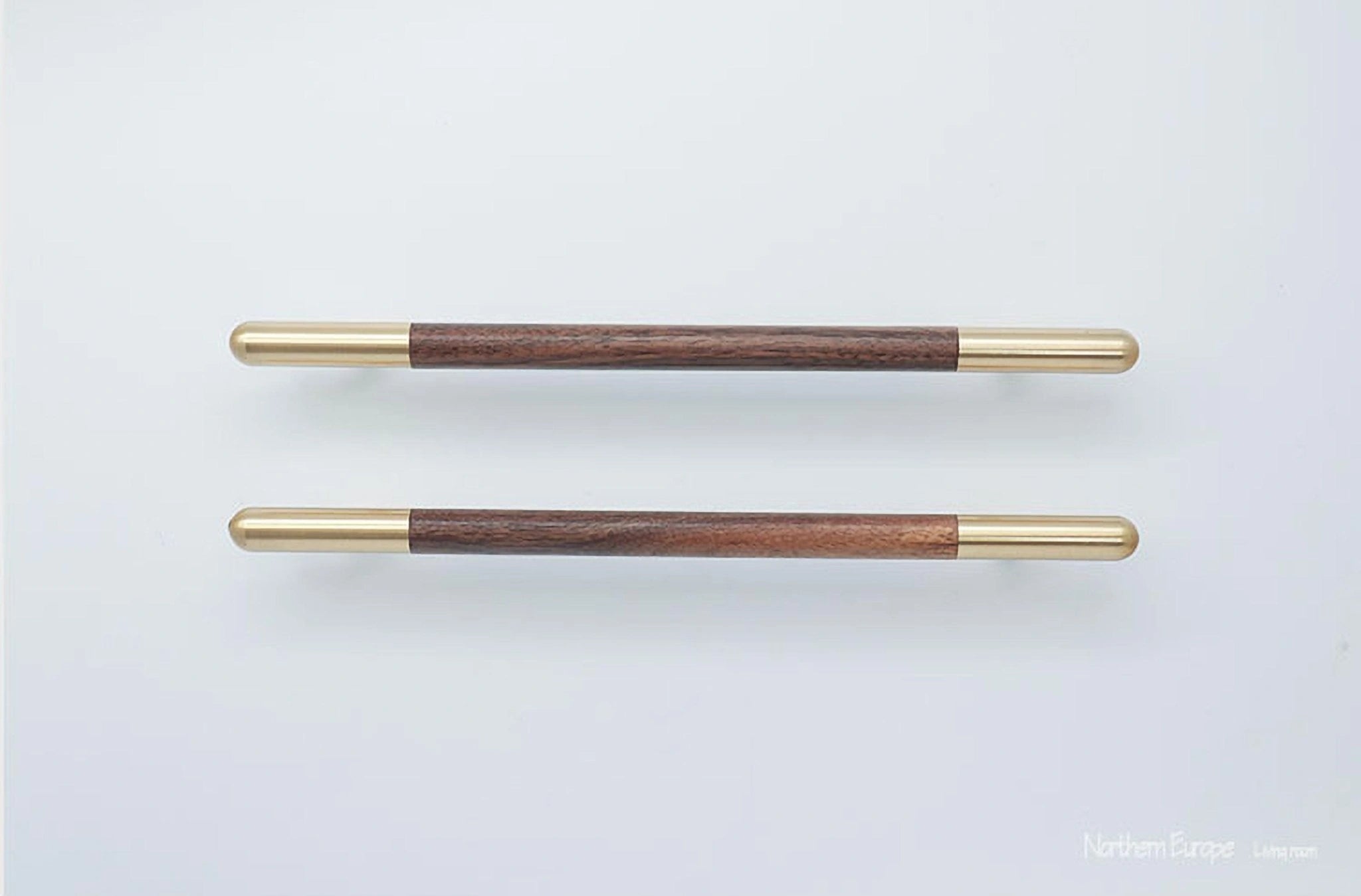 Mantara Mahogany Handle W-0003-H is a natural wood handle in brown with brushed brass finish, ideal for doors & furniture.