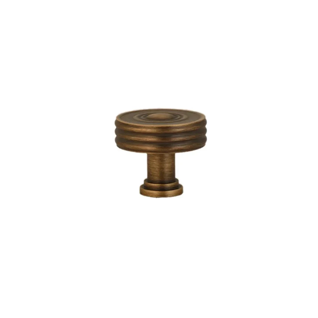 The Mantara B-0121 is a modern brass knob in bronze with a brushed finish, ideal for kitchen drawers and dressers.