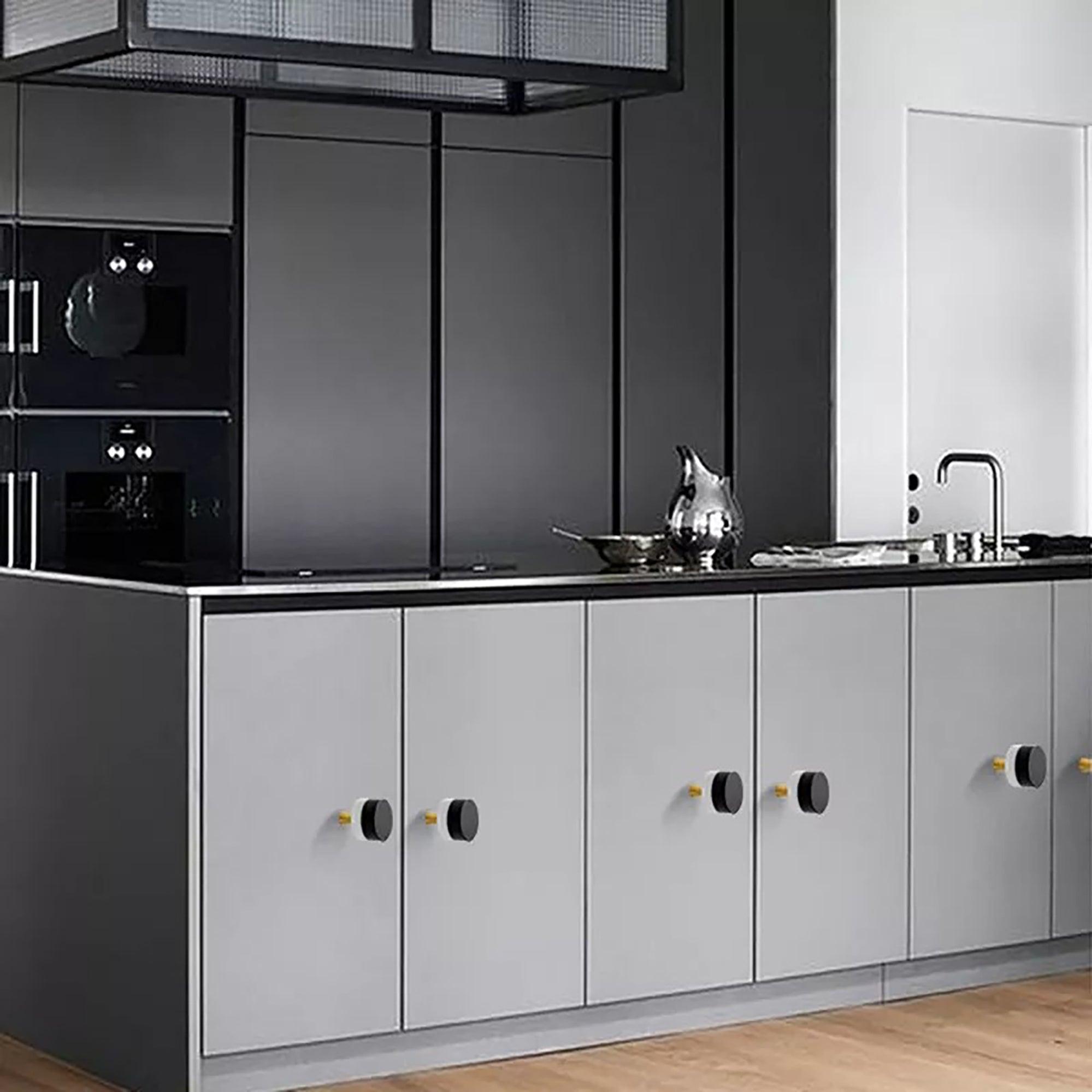 Marbella Knob M-0011 in black marble & brass, polished finish, 31mm, for modern kitchen cabinets by Mantara