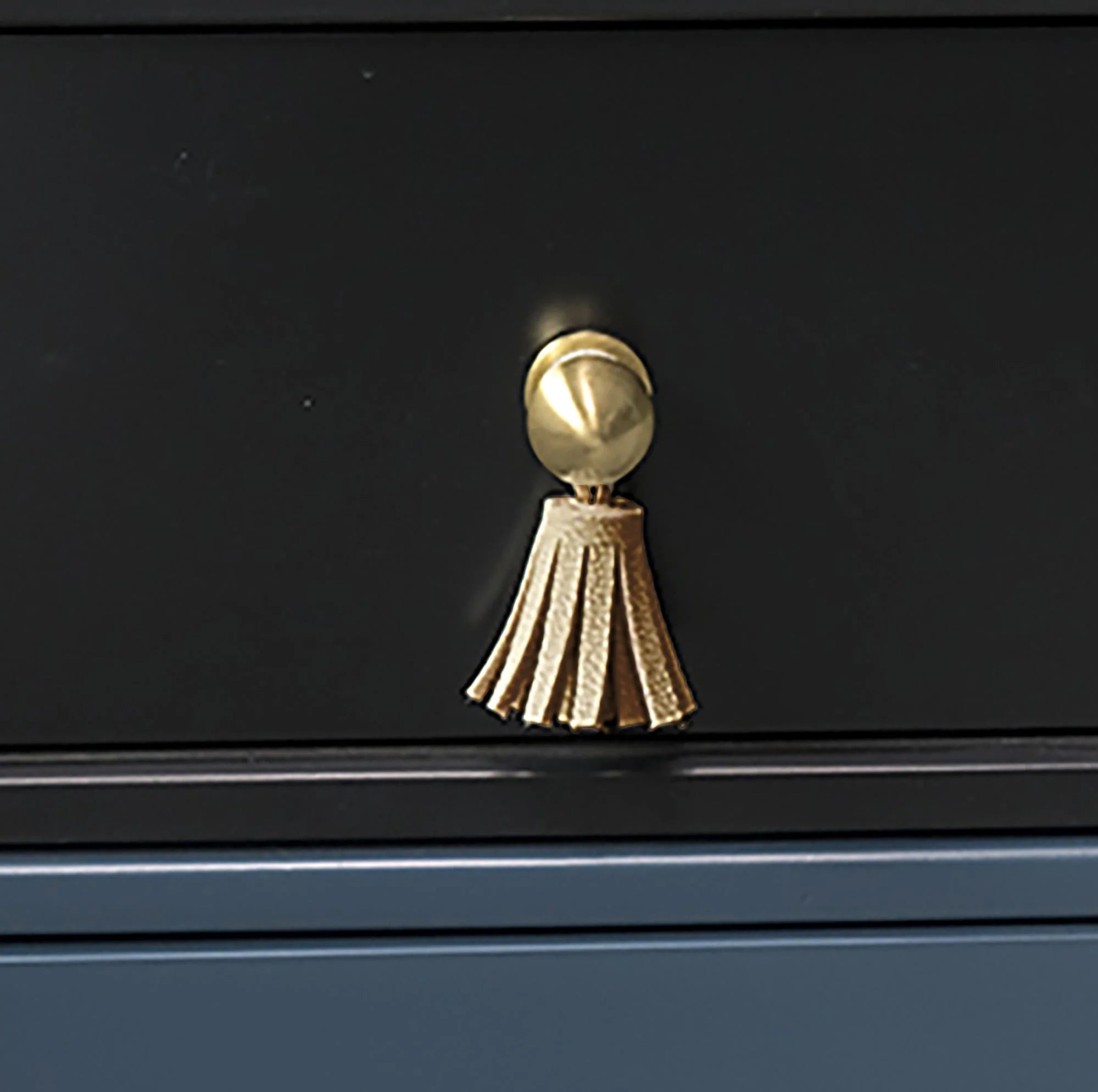The Mantara L-0002 Maverick Drop Knob is a modern leather and brass knob in white, ideal for kitchens and furniture.