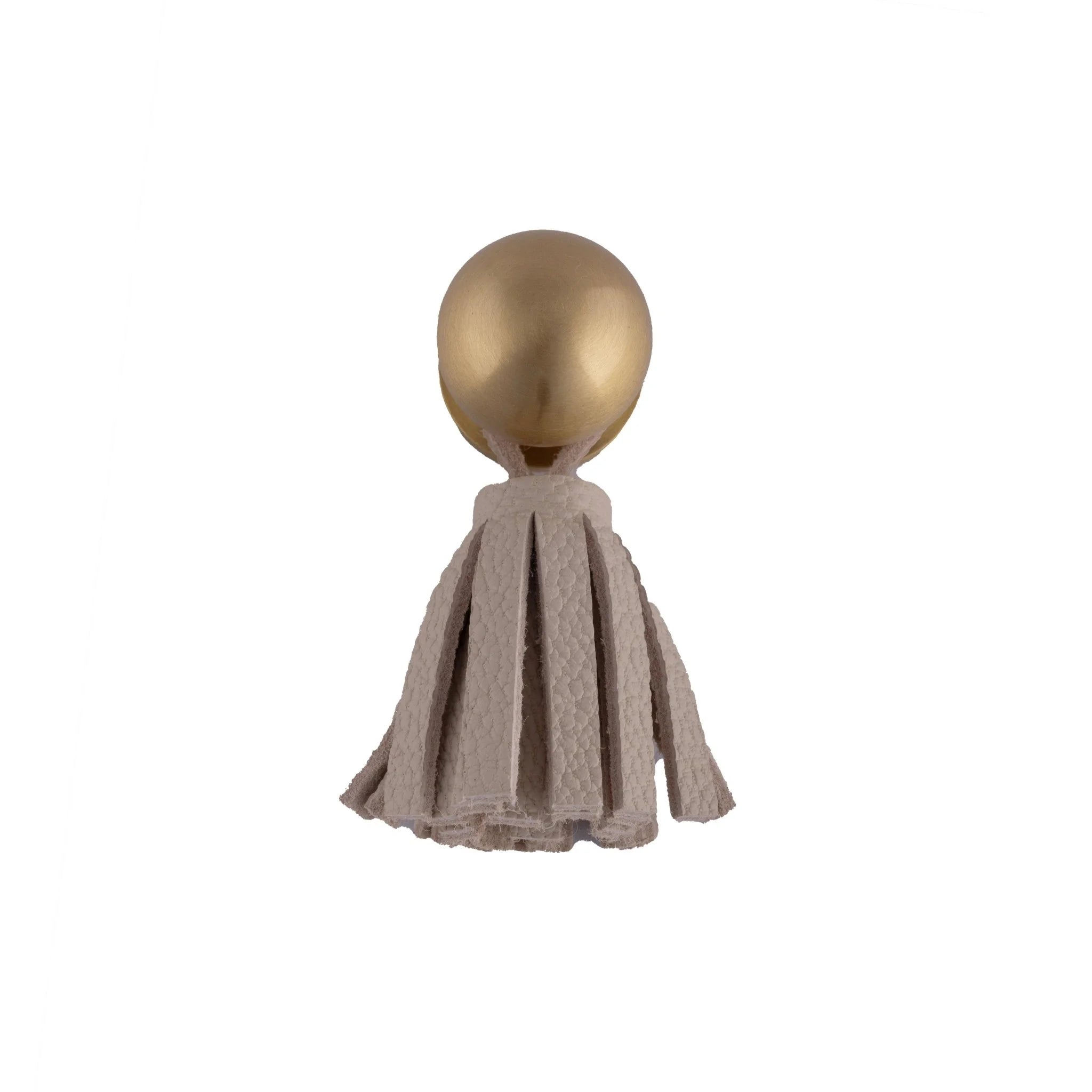 The Mantara L-0002 Maverick Drop Knob is a modern leather and brass knob in white, ideal for kitchens and furniture.