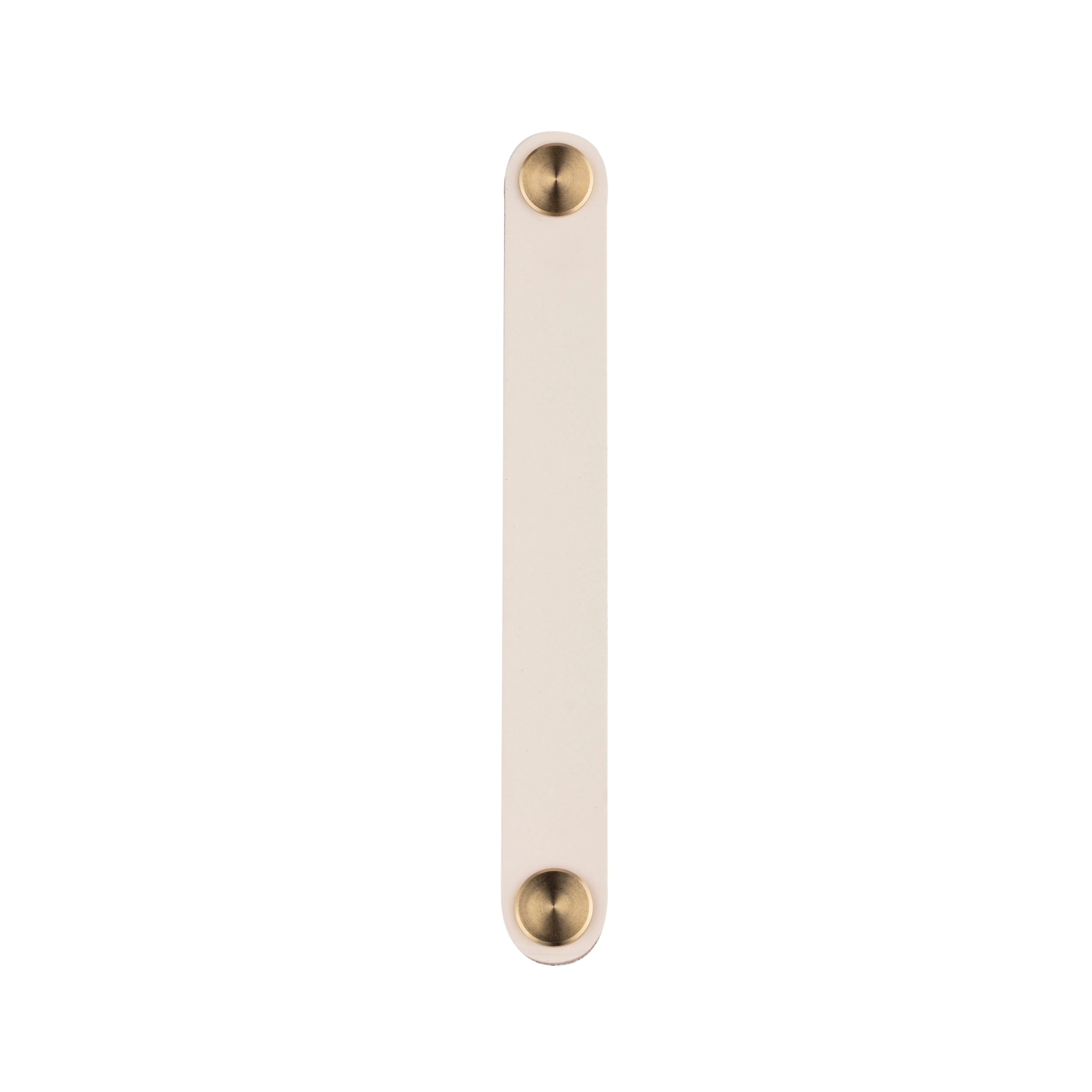 The Mantara L-0001-160 Maverick Handle is a Nordic leather and brass handle in white, ideal for kitchens and wardrobes.