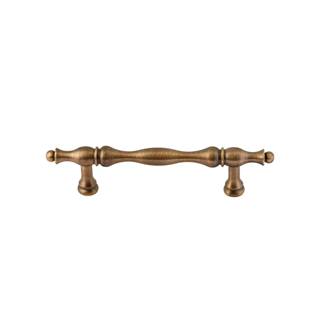 The Mantara B-0125 Miren Handle is a modern brass handle in bronze and gold, ideal for kitchen drawers, cabinets, and furniture.