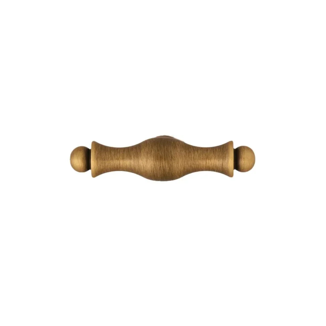 The Mantara B-0125 Miren Handle is a modern brass handle in bronze and gold, ideal for kitchen drawers, cabinets, and furniture.