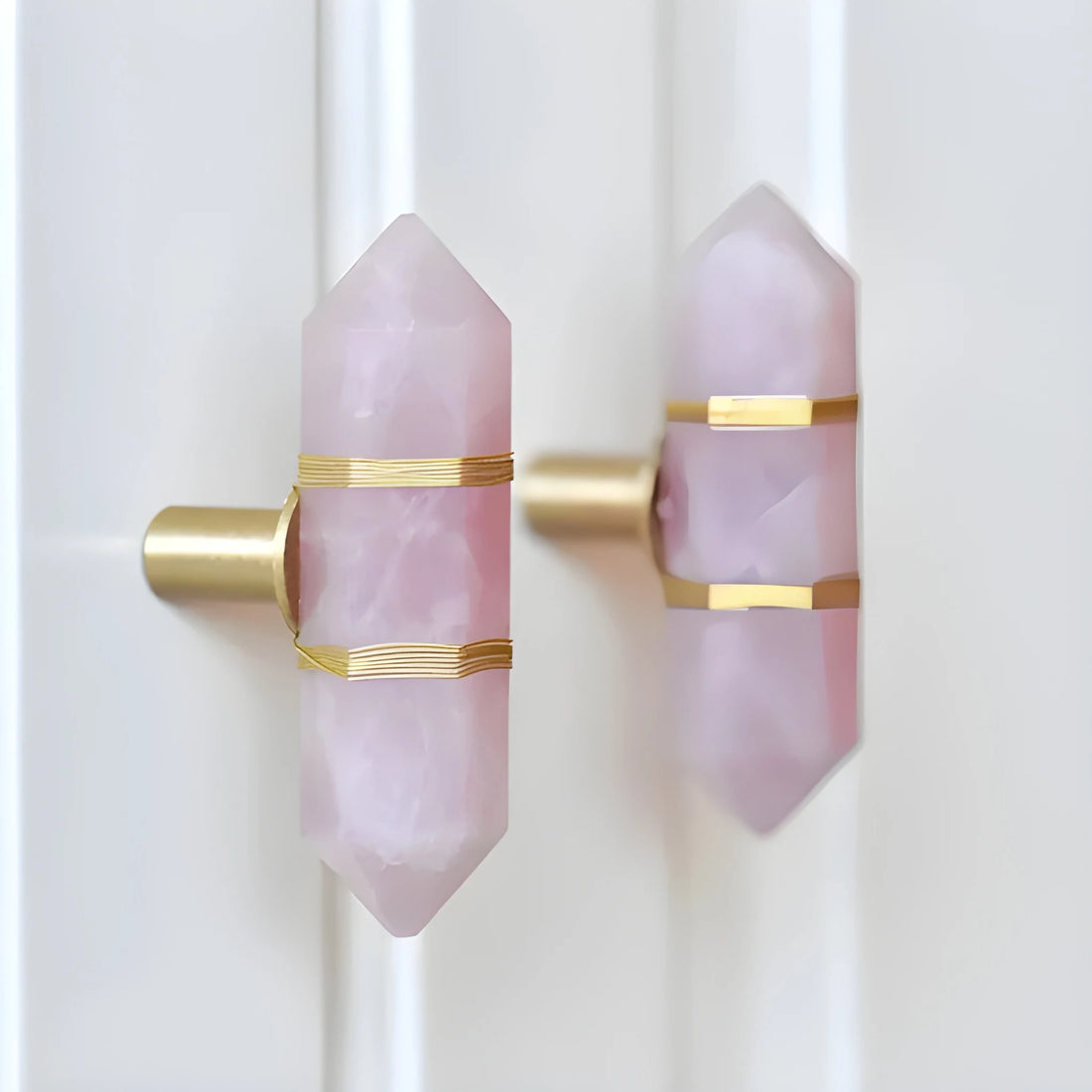 The Mantara C-0013 Mystic Handle is a modern crystal and brass knob in pink, ideal for drawers and cabinets.