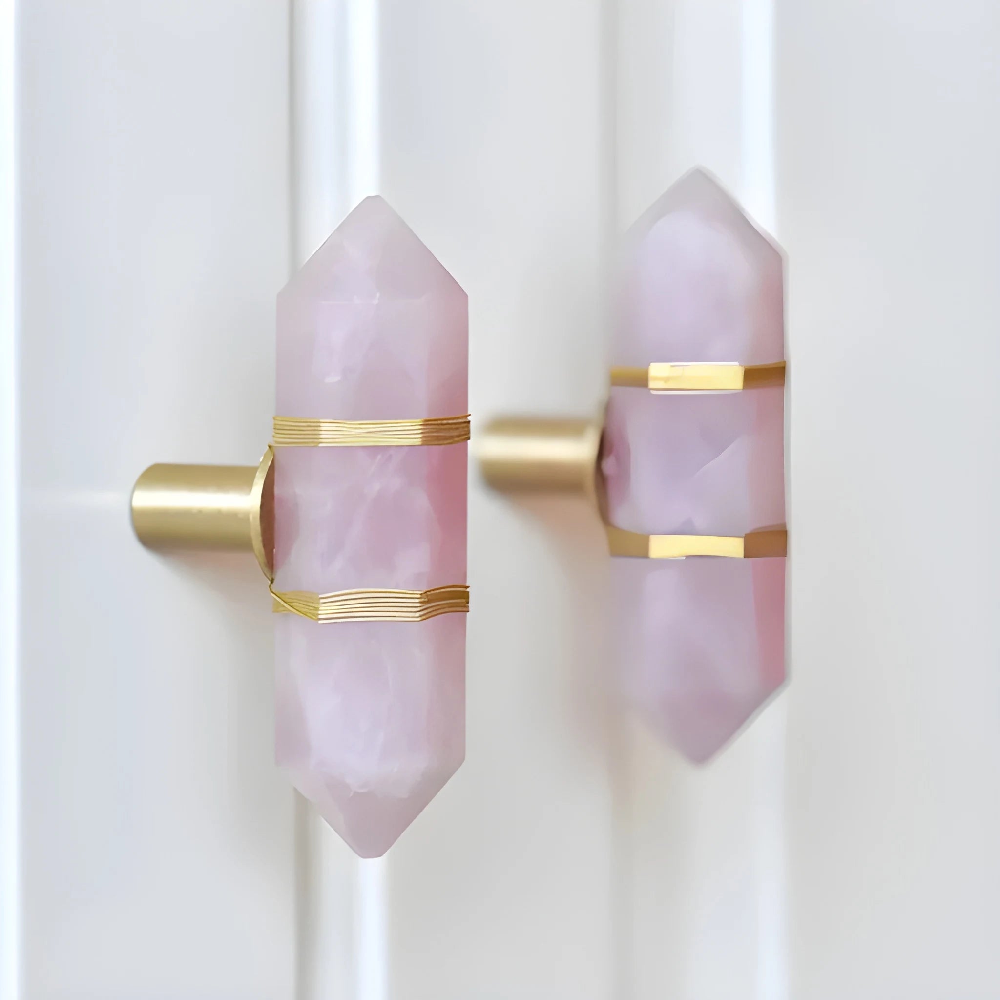 The Mantara C-0013 Mystic Handle is a modern crystal and brass knob in pink, ideal for drawers and cabinets.