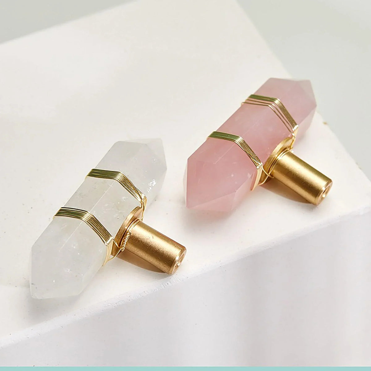 Two crystal.Decimal earrings with gold accents on a light background