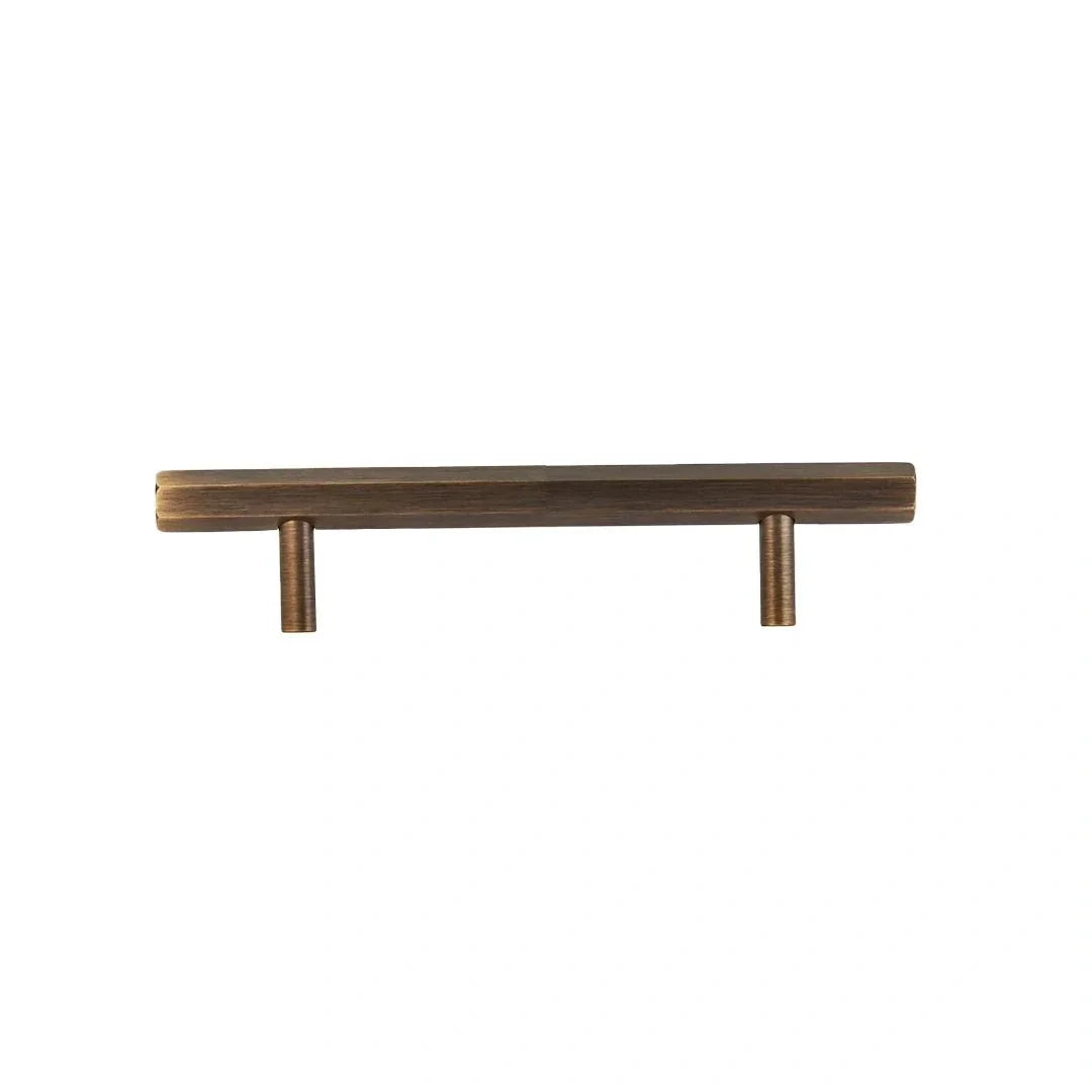 The Mantara B-0052 Oblivion T-Bar Handle is a modern solid brass handle in bronze, ideal for cabinets and kitchens.