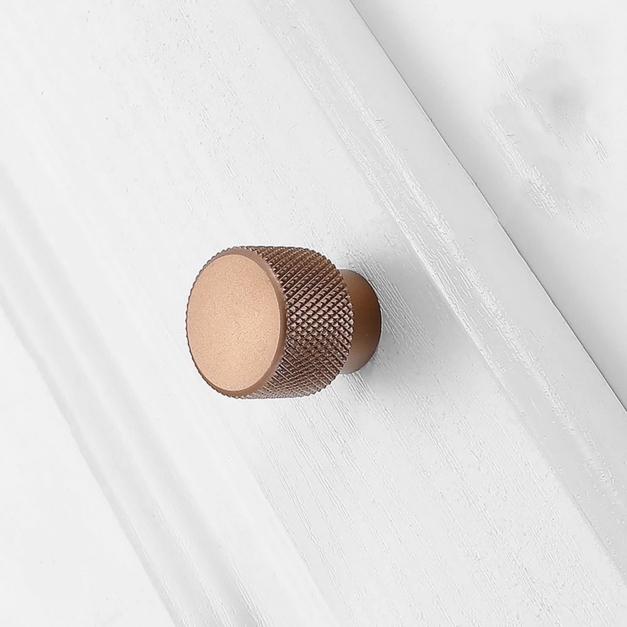 A knurled aluminum alloy knob/handle in matte grey and rose gold finish, Mantara AL-0001 furniture hardware, MANTARA.