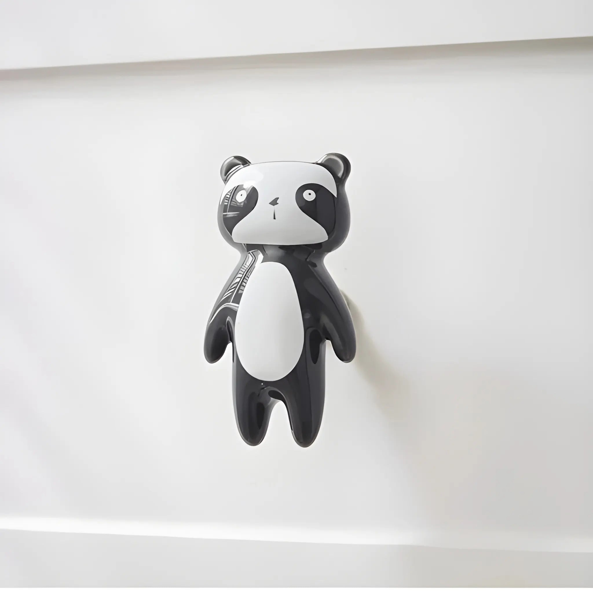 The Mantara CR-0001-Panda Knob is a modern black ceramic knob with a polished finish, perfect for wardrobes, drawers, cabinets, and kids&