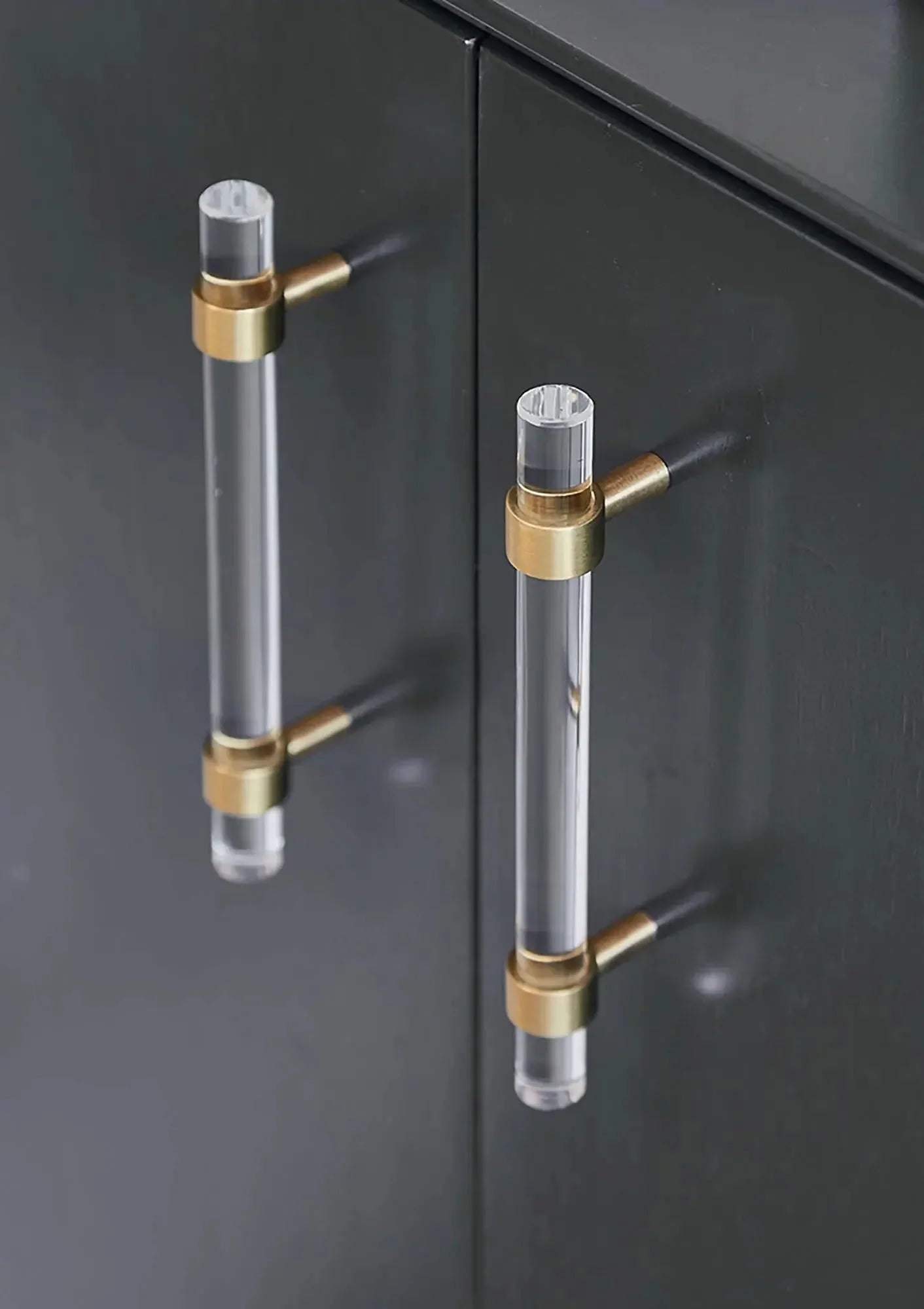 A sleek T-bar handle, Petra II made of clear acrylic with brushed brass supports in transparent white finish, model A-0008 by Mantara, A-0008.