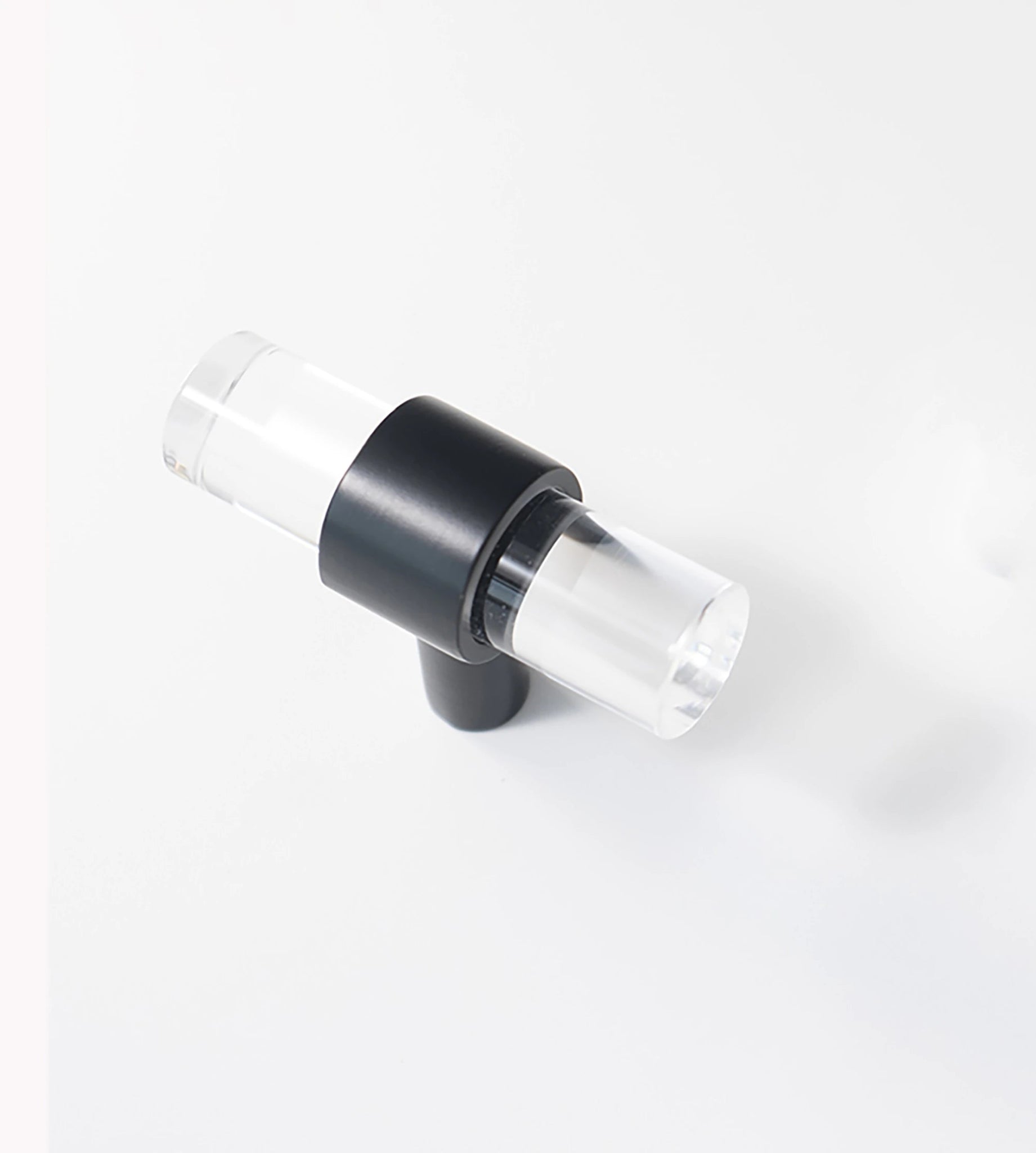 An elegant cabinet bar handle, Petra IV crafted from acrylic in polished black finish, model A-0010 by Mantara, A-0010.