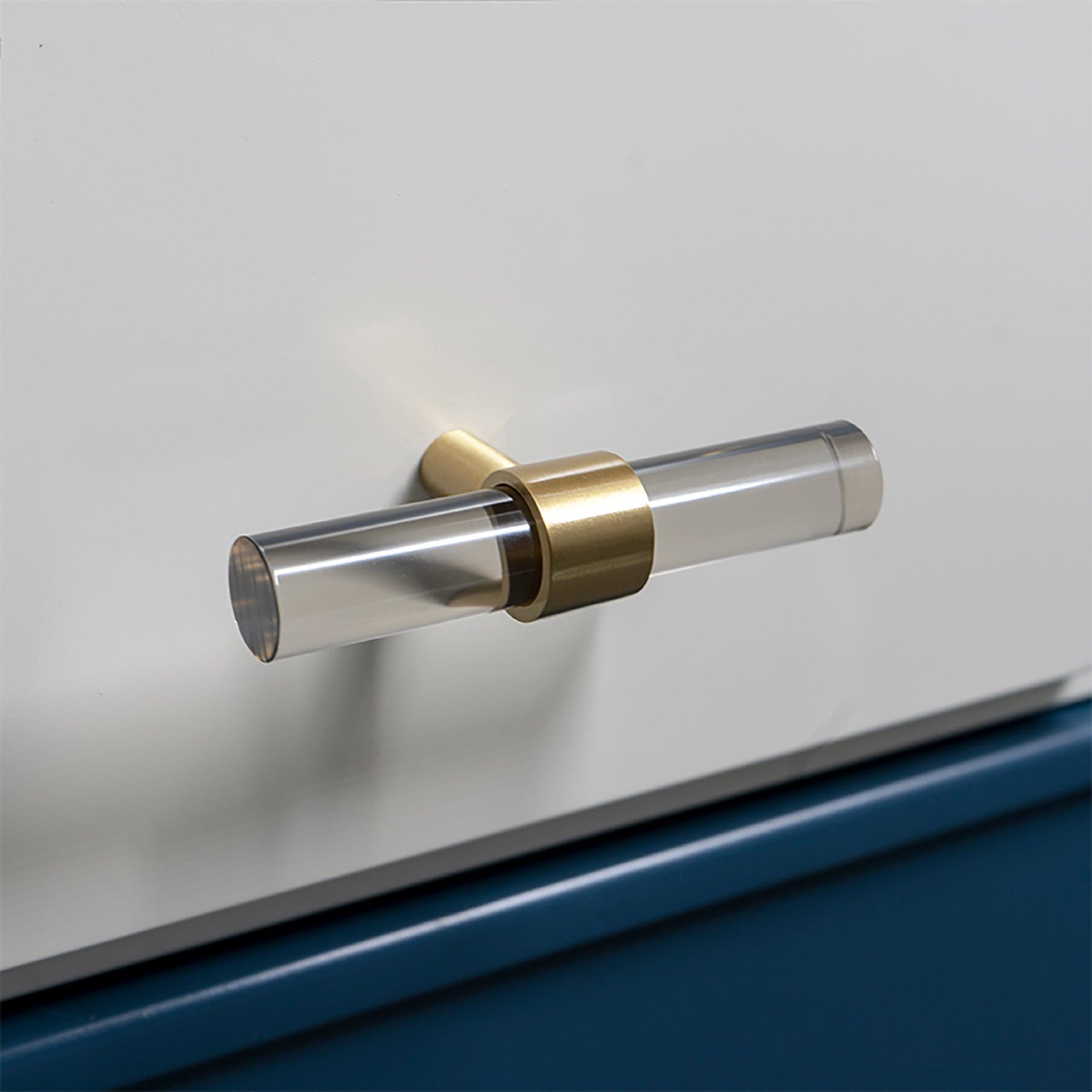 A modern cabinet bar handle, Petra V crafted from grey acrylic with polished brass mounts, model A-0011 by Mantara, SKU A-0011.
