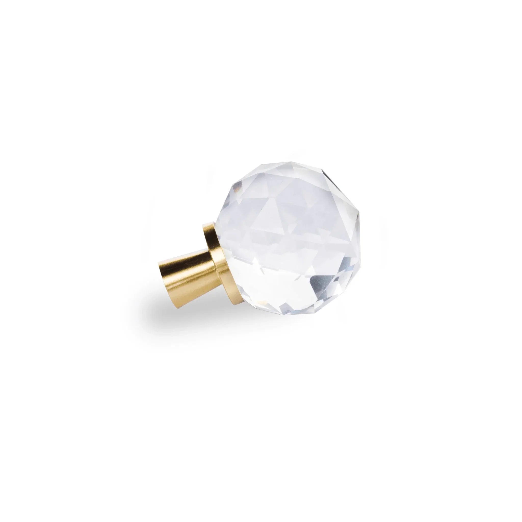 The Mantara C-0016 Quartz Handle is a modern crystal knob in white with polished brass, ideal for wardrobes, cabinets, and kitchens.
