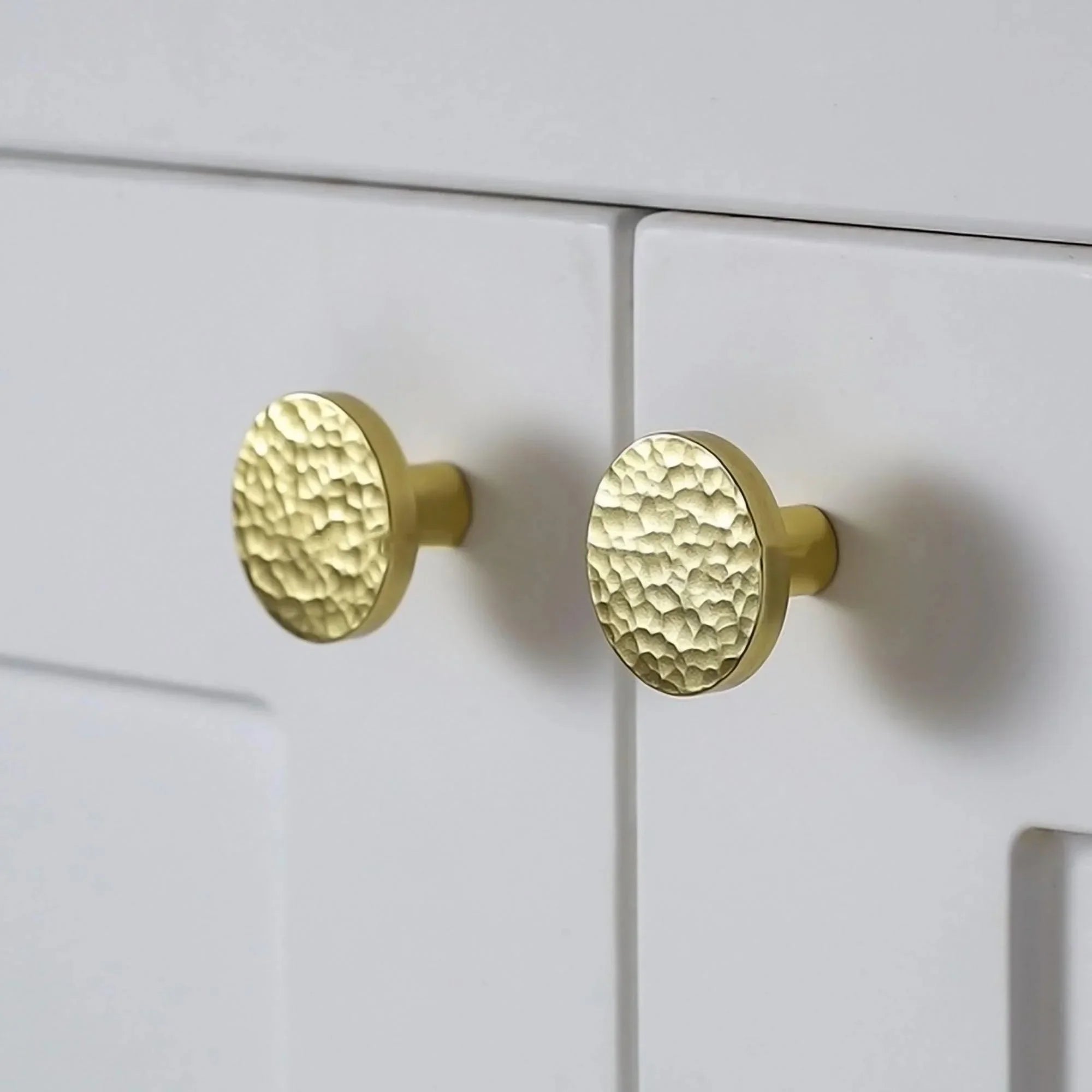 The Radiant Bloom Knob by Mantara B-0109 is a brushed brass round knob in gold, ideal for drawers, cabinets, and kitchens.