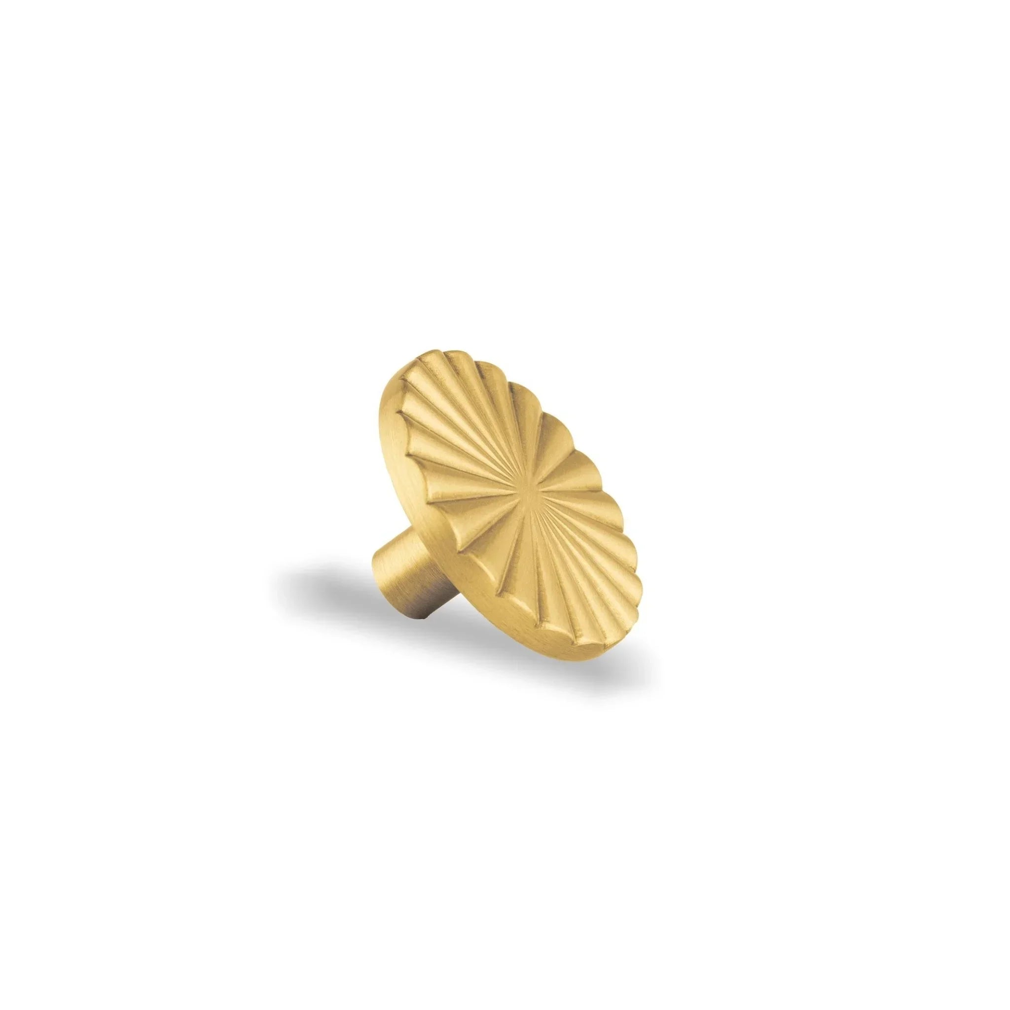 The Mantara B-0028 Rasya Knob is a modern gold brass knob with brushed finish, ideal for doors, drawers, cabinets, and wardrobes.