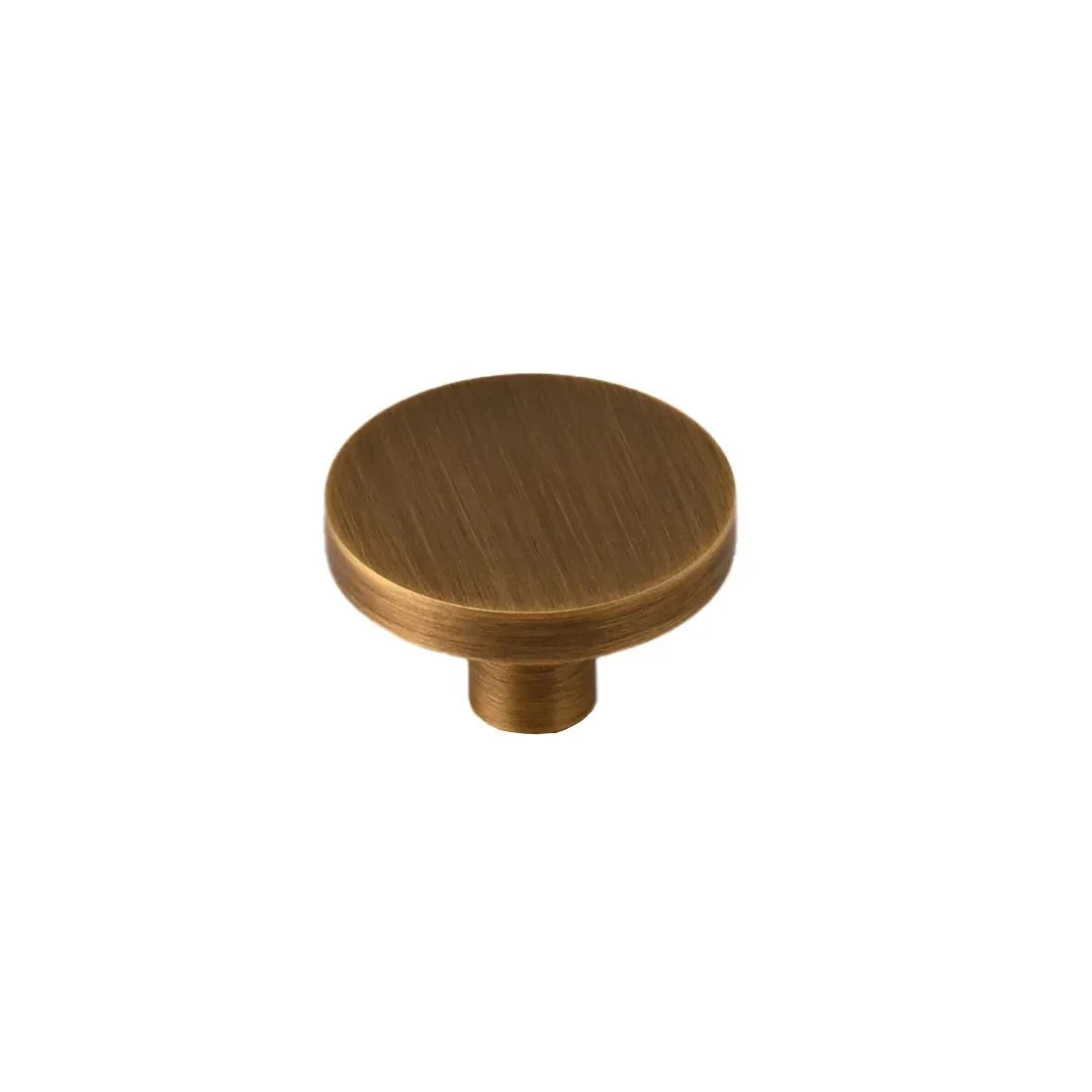 The Mantara B-0004 Regal Gold Knob is a modern solid brass knob in bronze, ideal for cabinets and wardrobes.