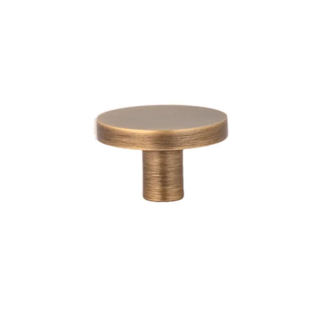 The Mantara B-0004 Regal Gold Knob is a modern solid brass knob in bronze, ideal for cabinets and wardrobes.
