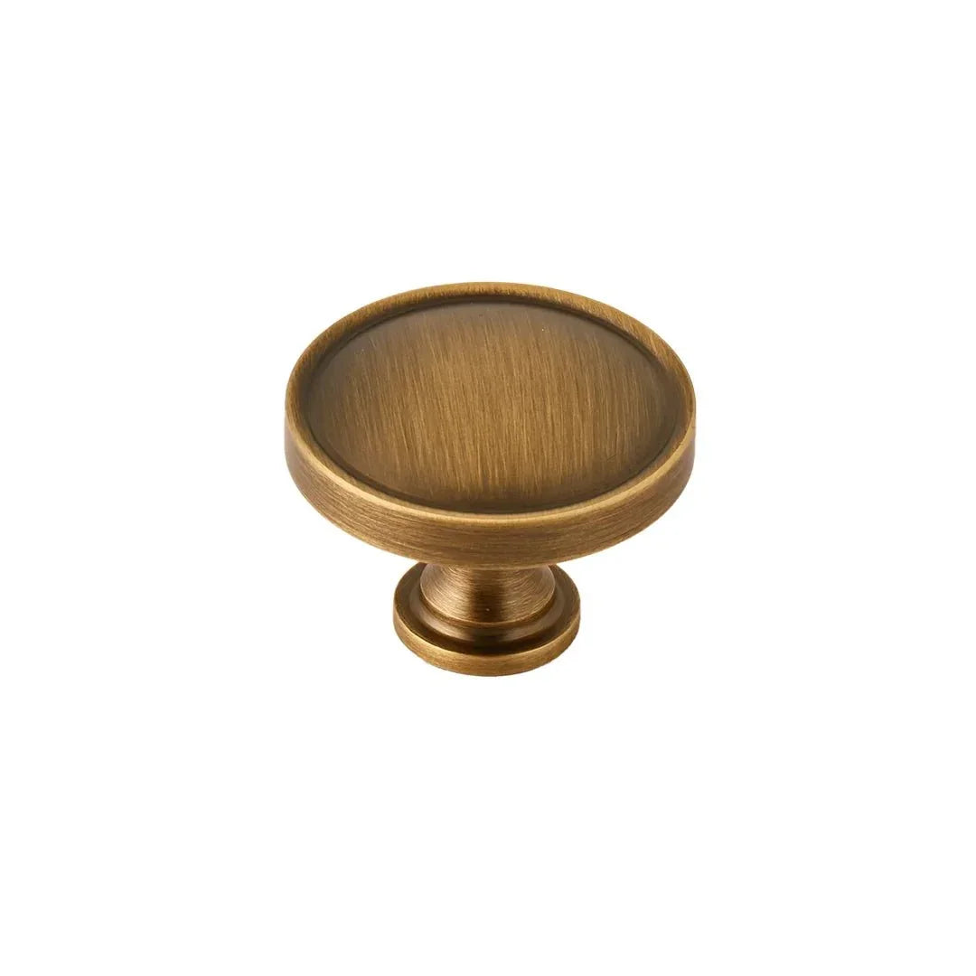 The Mantara B-0007 Regina Knob is a modern brass knob in satin gold and bronze, perfect for kitchens, cabinets, and furniture.