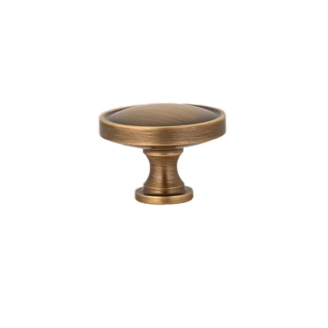 The Mantara B-0007 Regina Knob is a modern brass knob in satin gold and bronze, perfect for kitchens, cabinets, and furniture.