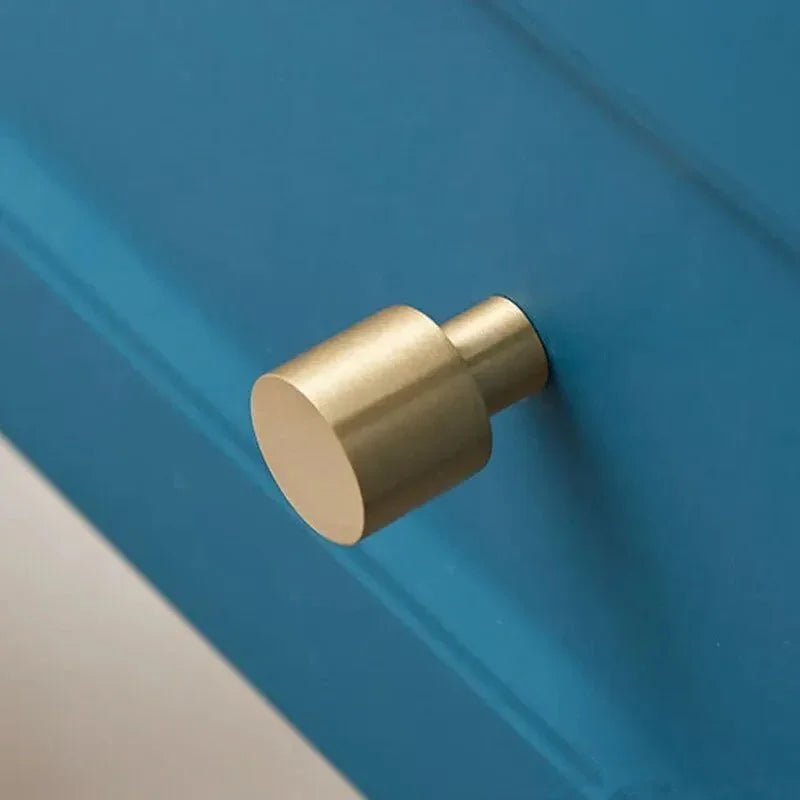 The Mantara B-0003 Salden Knob is a modern brass knob in gold with a brushed finish, ideal for wardrobes, drawers, and cabinets.