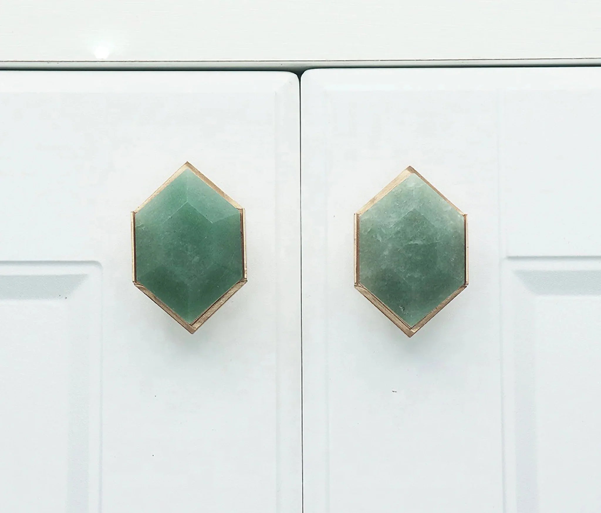 The Mantara C-0004 is a Nordic crystal + brass knob in green, ideal for wardrobes, drawers & cabinets.