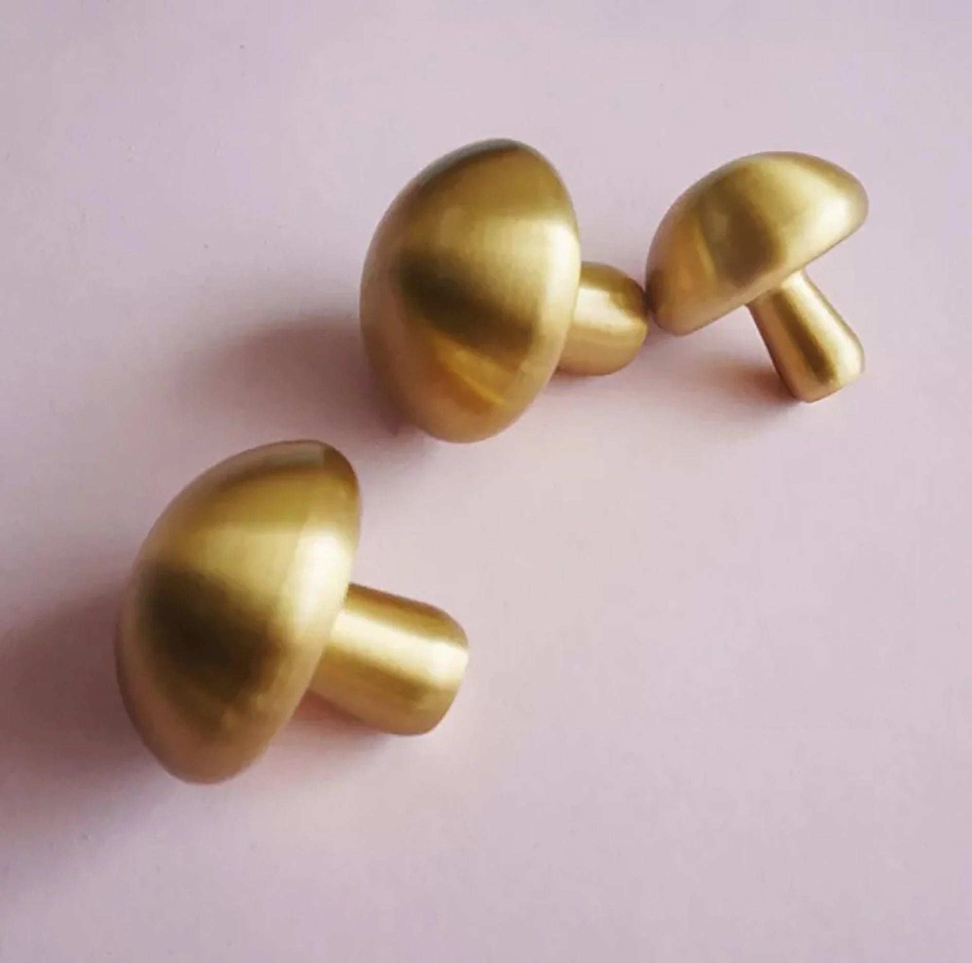 Mantara Shroom Knob B-0100 is a modern solid brass knob in brushed gold, perfect for kitchens, cabinets, and furniture.
