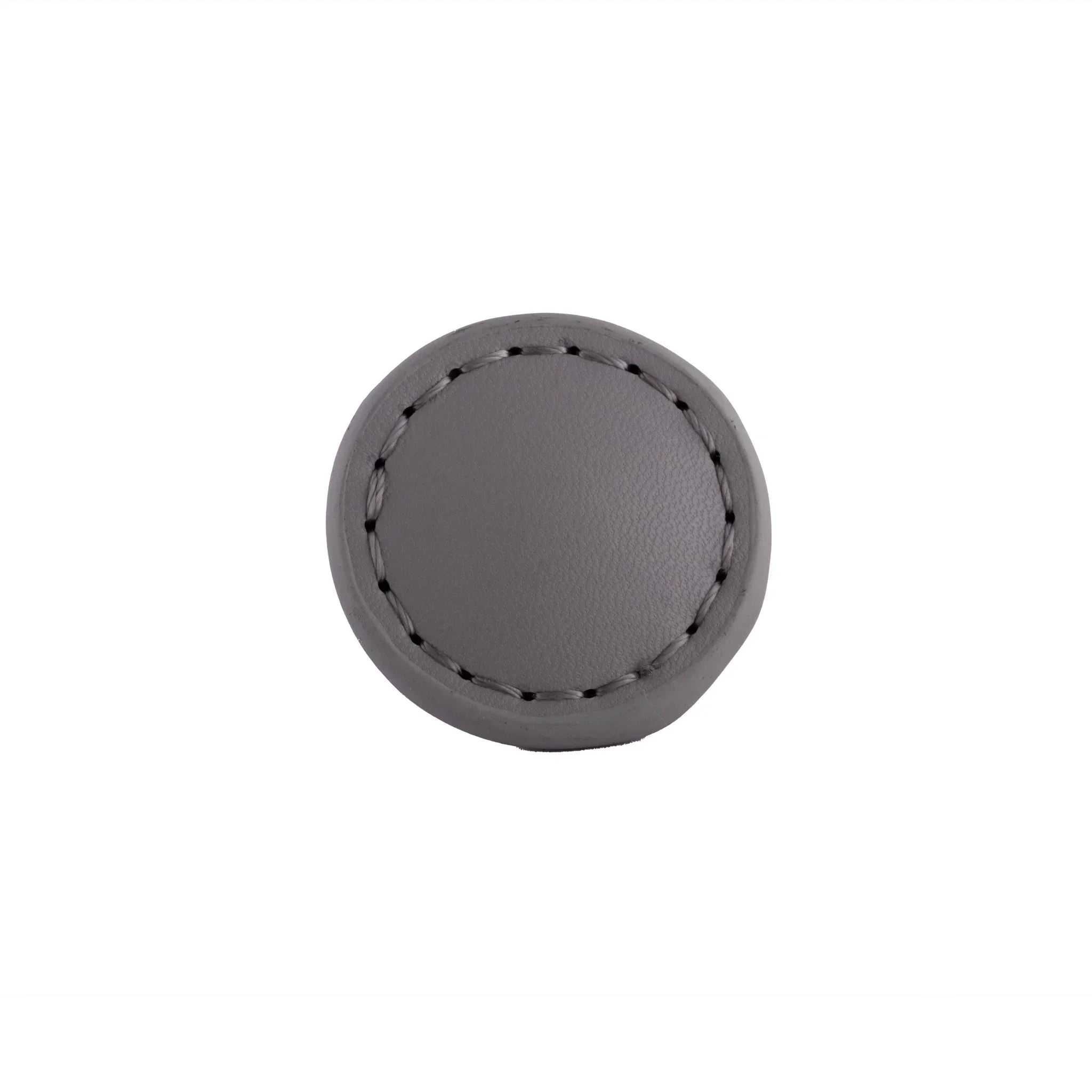 The Mantara L-0008 Sofia Round Knob is a modern leather knob in grey, ideal for cabinets and wardrobes.