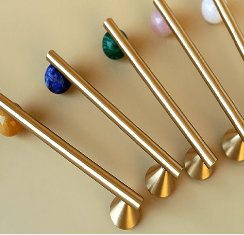 The Mantara C-0022 Solstice Handle is a modern crystal and brass handle in green and white, ideal for wardrobes, drawers, and cabinets.