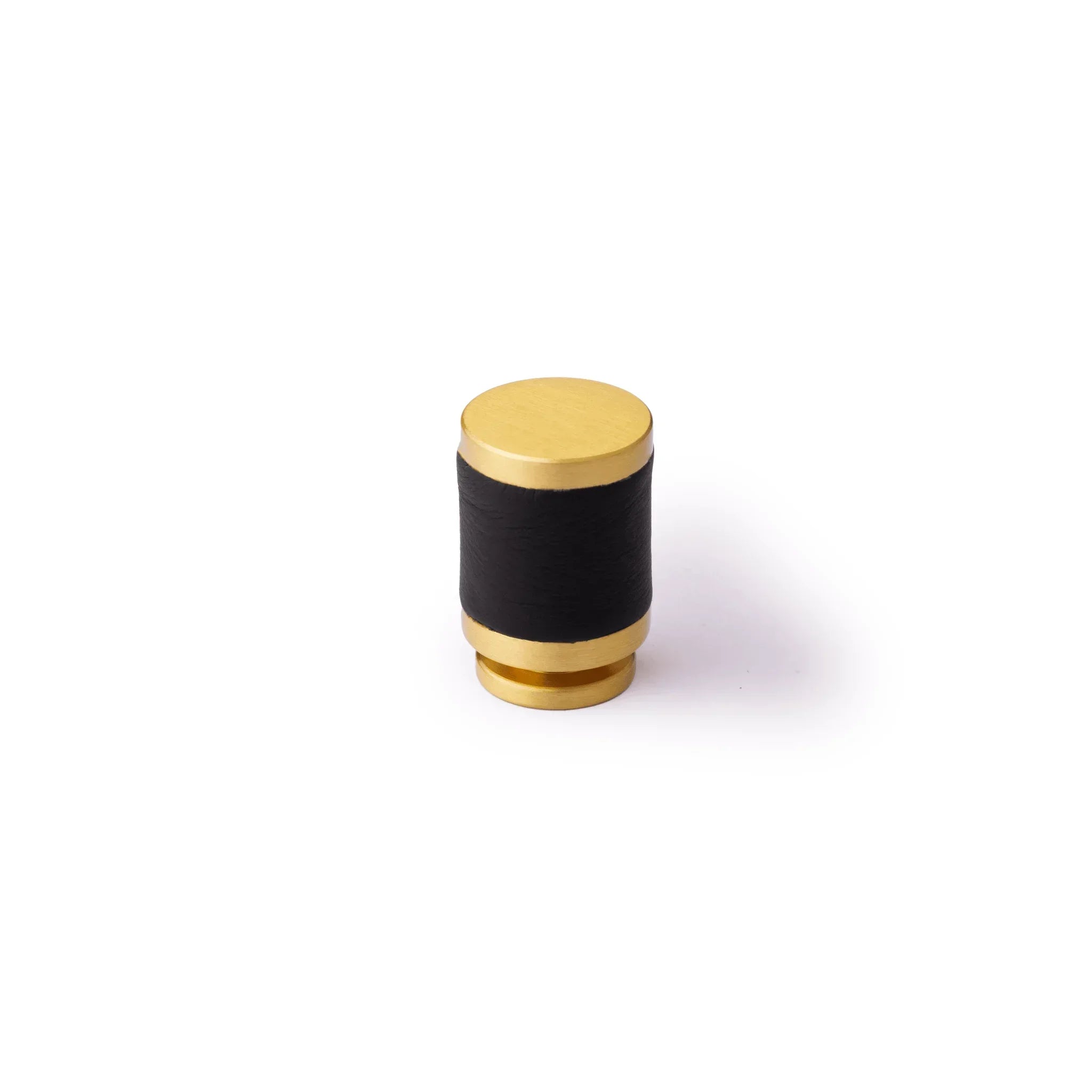 The Mantara L-0003 Tanner Knob is a modern brass and leather knob in black, perfect for cabinets and furniture.
