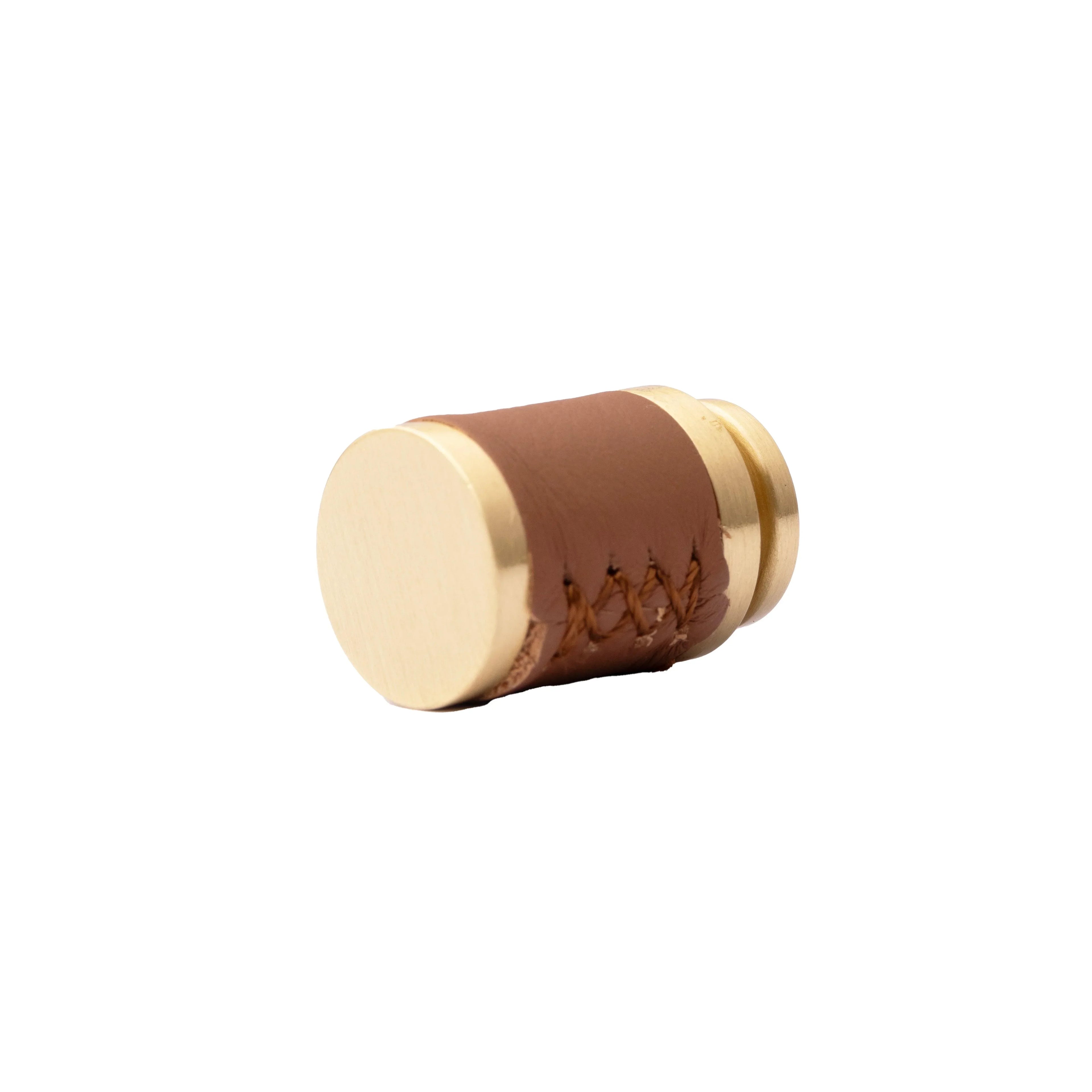 The Mantara L-0003 Tanner Knob is a modern brass and leather knob in brown, perfect for cabinets and furniture.