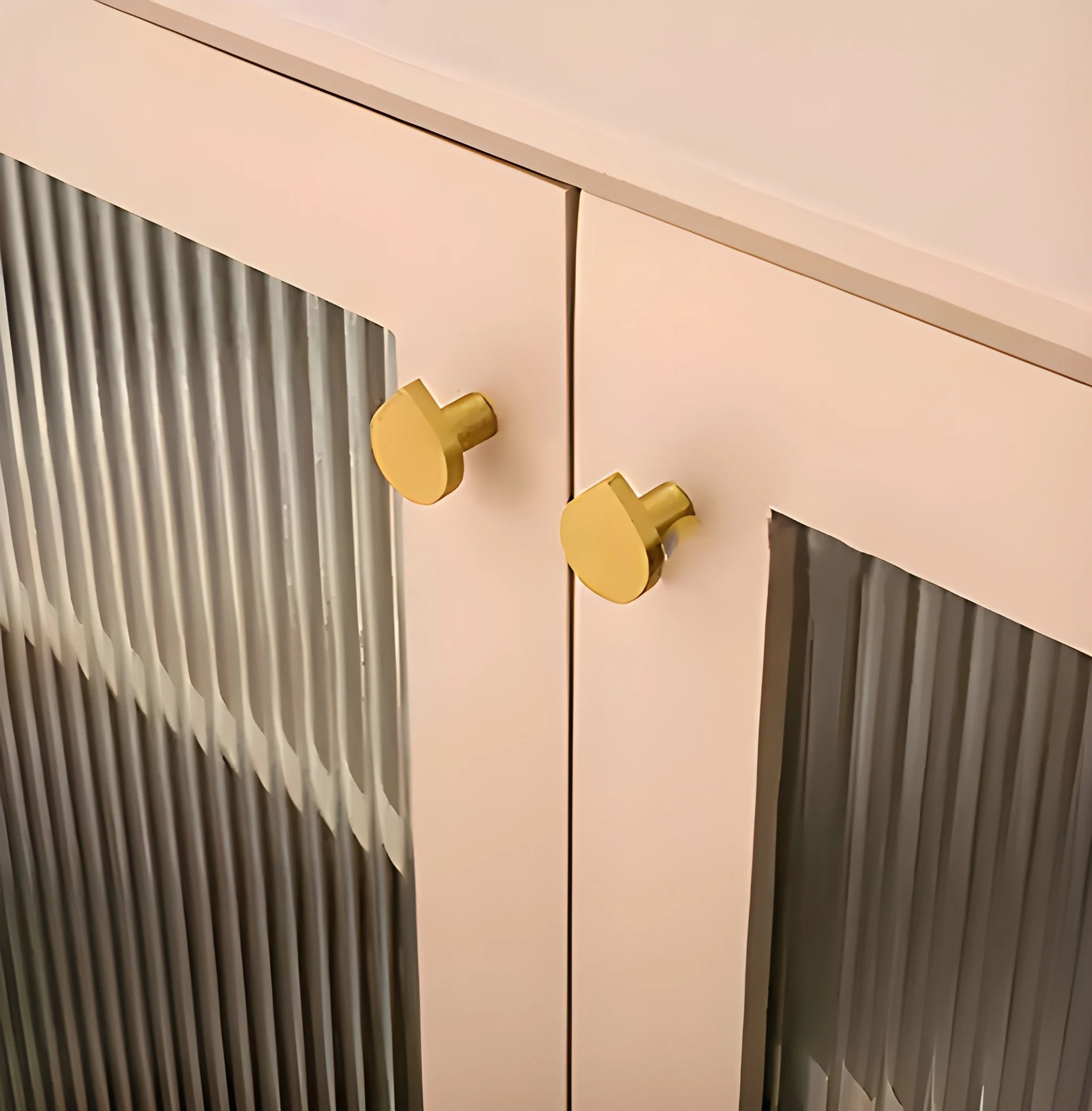 The Tarang Knob by Mantara (B-0104) is a brushed brass modern pair knob in gold, perfect for wardrobes, doors, and kitchens.